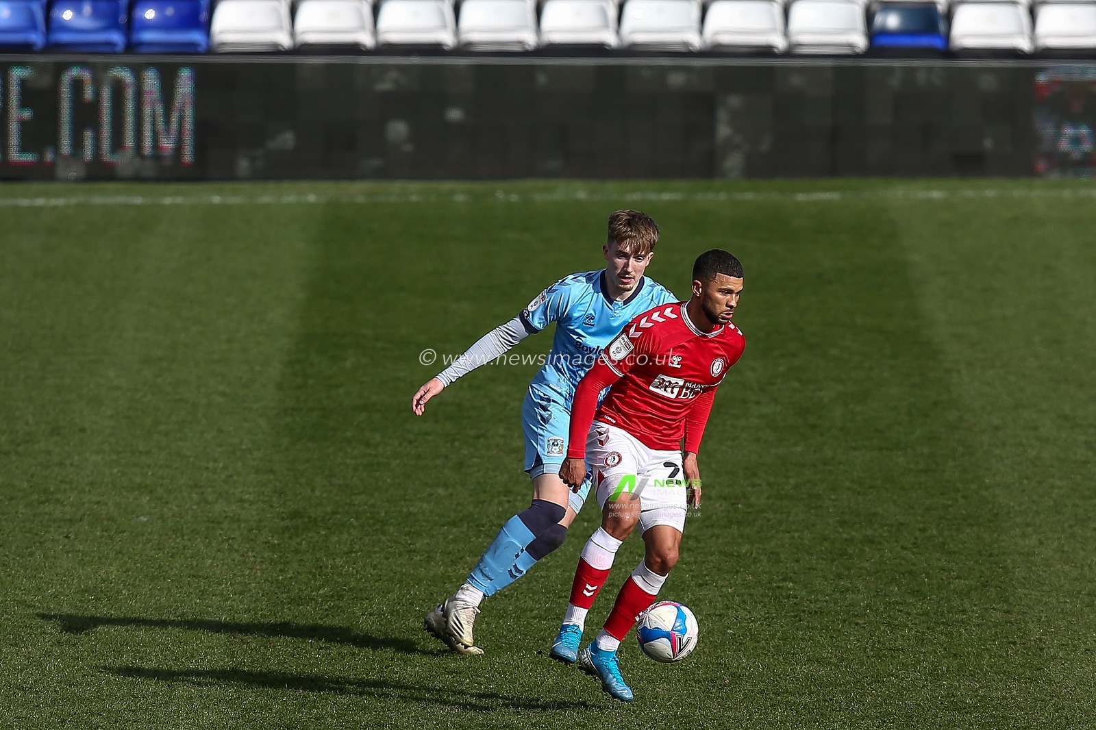 Nahki Wells #21 of Bristol City dribbles the ball whilst under pressure from Josh Eccles #28 of Coventry City