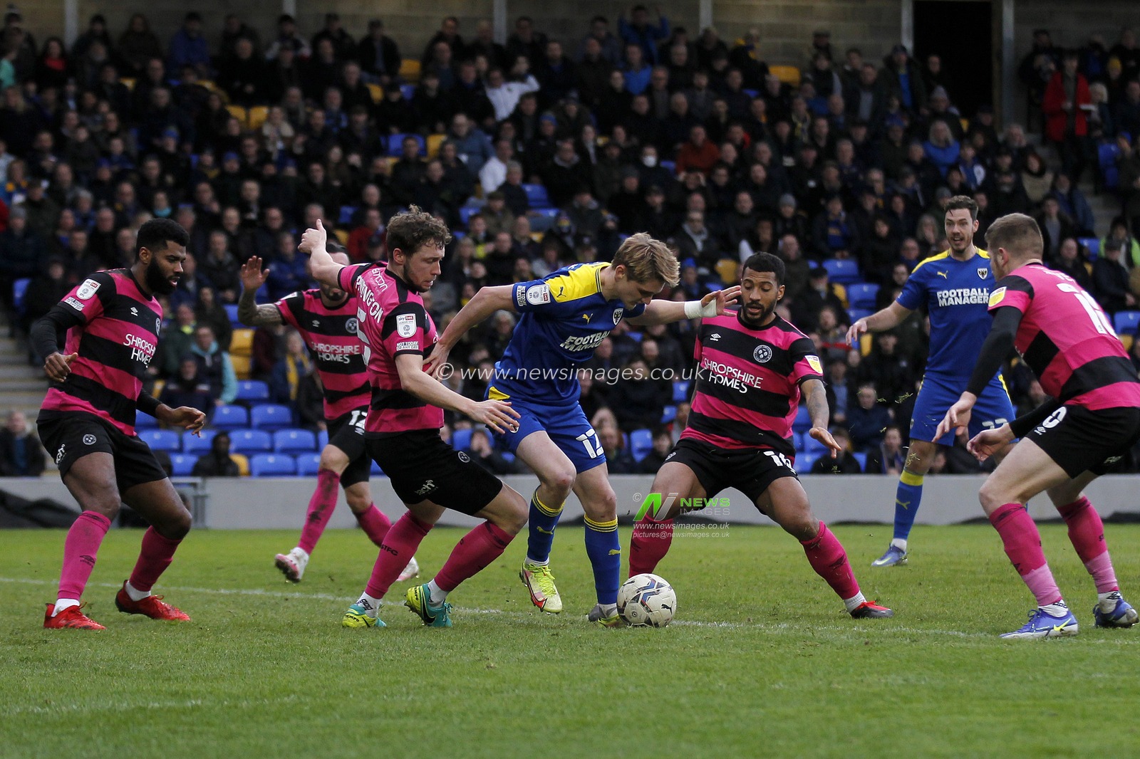 Jack Rudoni #12 of AFC Wimbledon surrounded in the penalty area