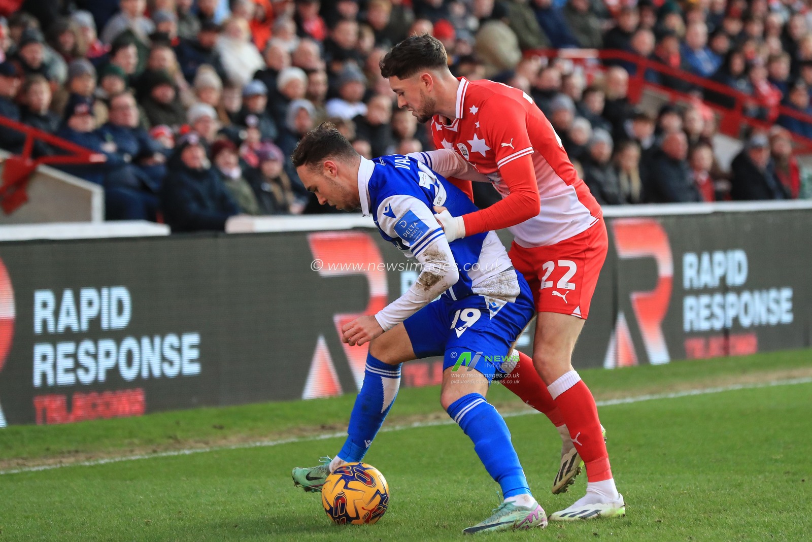 Harvey Vale of Bristol Rovers holds the ball as Corey O'Keeffe of Barnsley pressures during the Sky Bet League 1 match Barnsley vs Bristol Rovers at Oakwell, Barnsley, United Kingdom, 13th January 2024

(Photo by Alfie Cosgrove/News Images)
