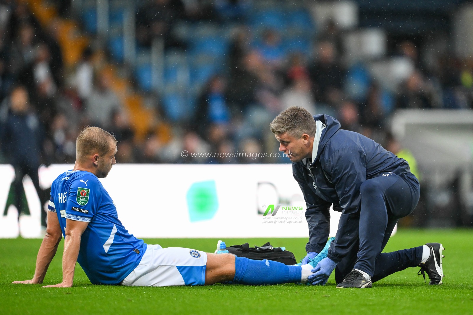 Sam Hughes of Stockport County receives treatment for an in jury during the Carabao Cup match Stockport County vs Blackburn Rovers at Edgeley Park Stadium, Stockport, United Kingdom, 13th August 2024

(Photo by Craig Thomas/News Images)