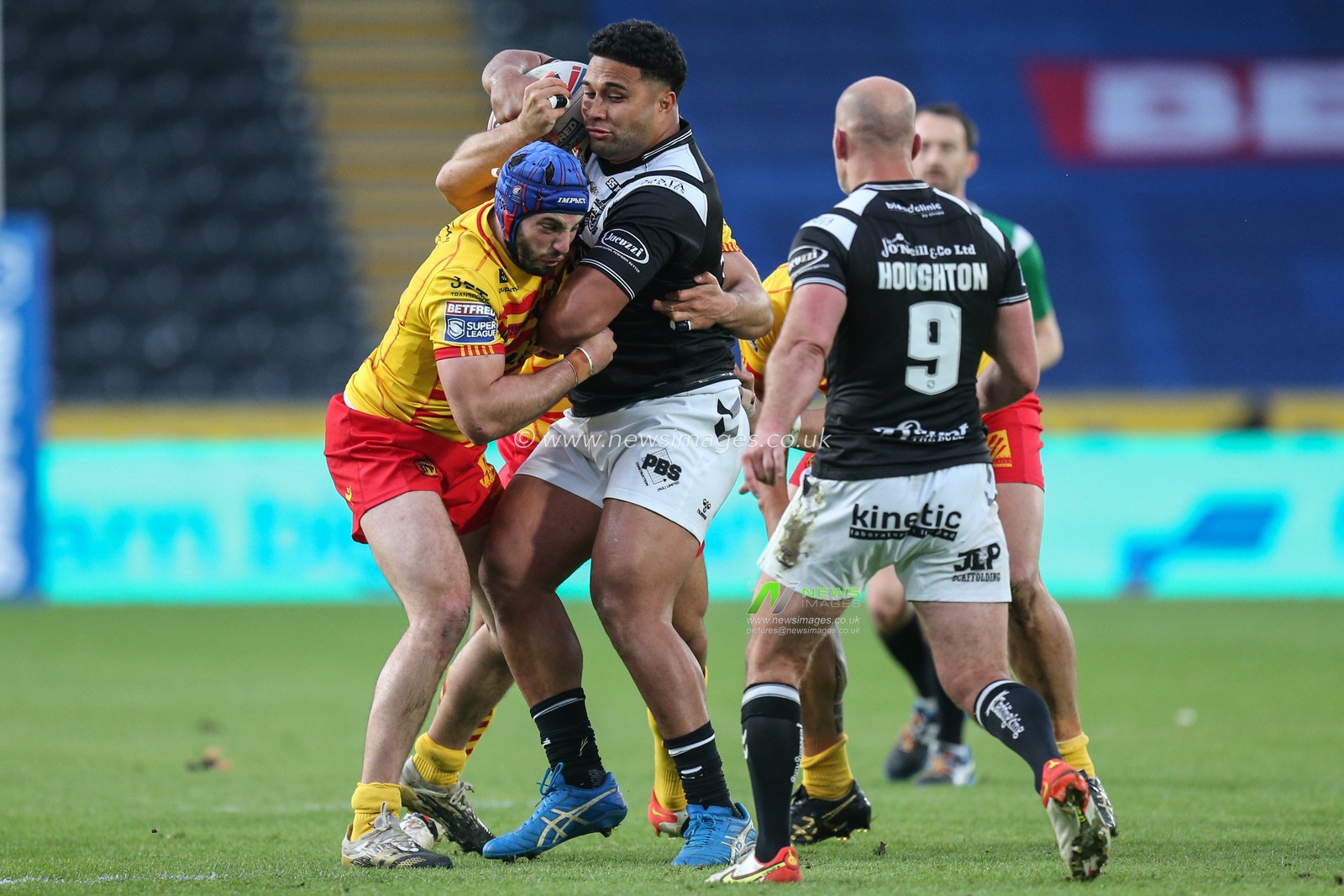 Chris Satae #10 of Hull FC looks for support in the tackle