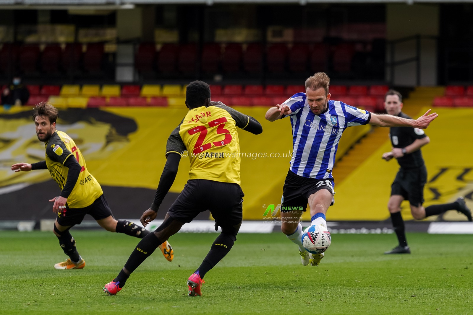 Jordan Rhodes #20 of Sheffield Wednesday battles with Ismaila Sarr #23 of Watford