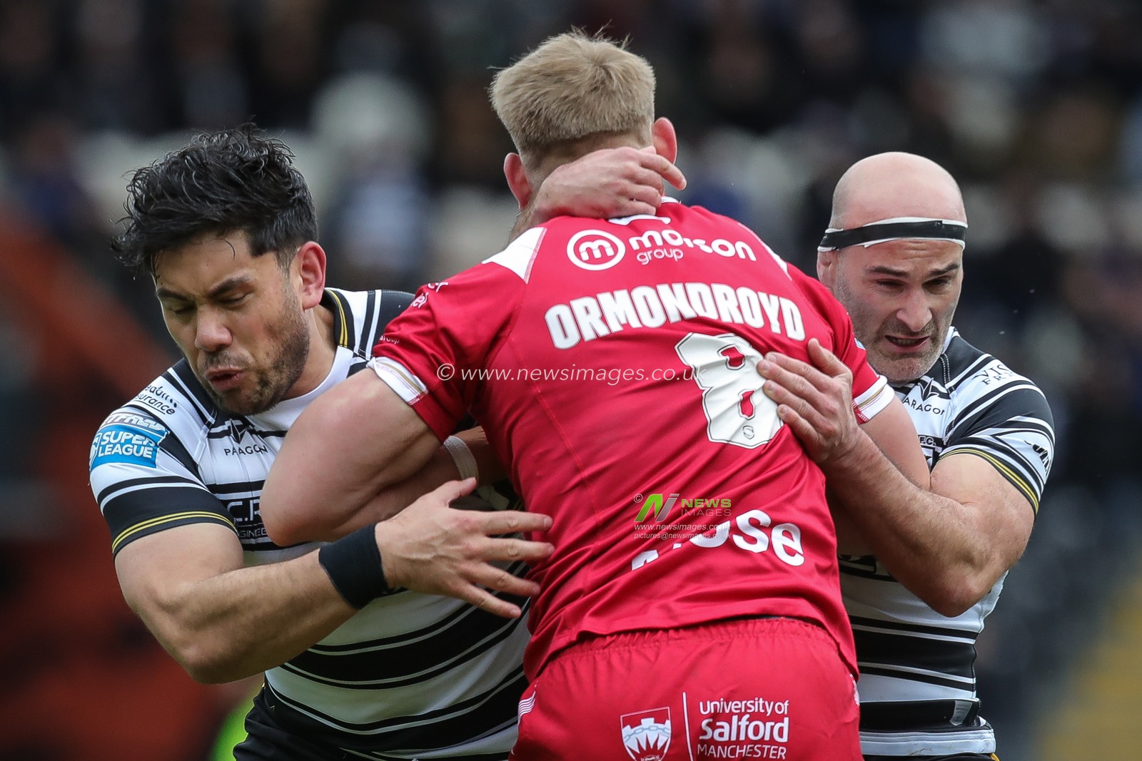 Jack Ormondroyd #8 of Salford Red Devils is tackled by Danny Houghton #9 and Andre Savelio #11 of Hull FC during the Betfred Super League Round 4 match Hull FC vs Salford Red Devils at MKM Stadium, Hull, United Kingdom, 11th March 2023

(Photo by James Heaton/News Images)