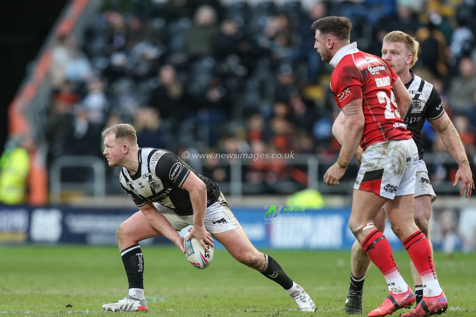 Jack Brown #20 of Hull FC looks to make a pass
