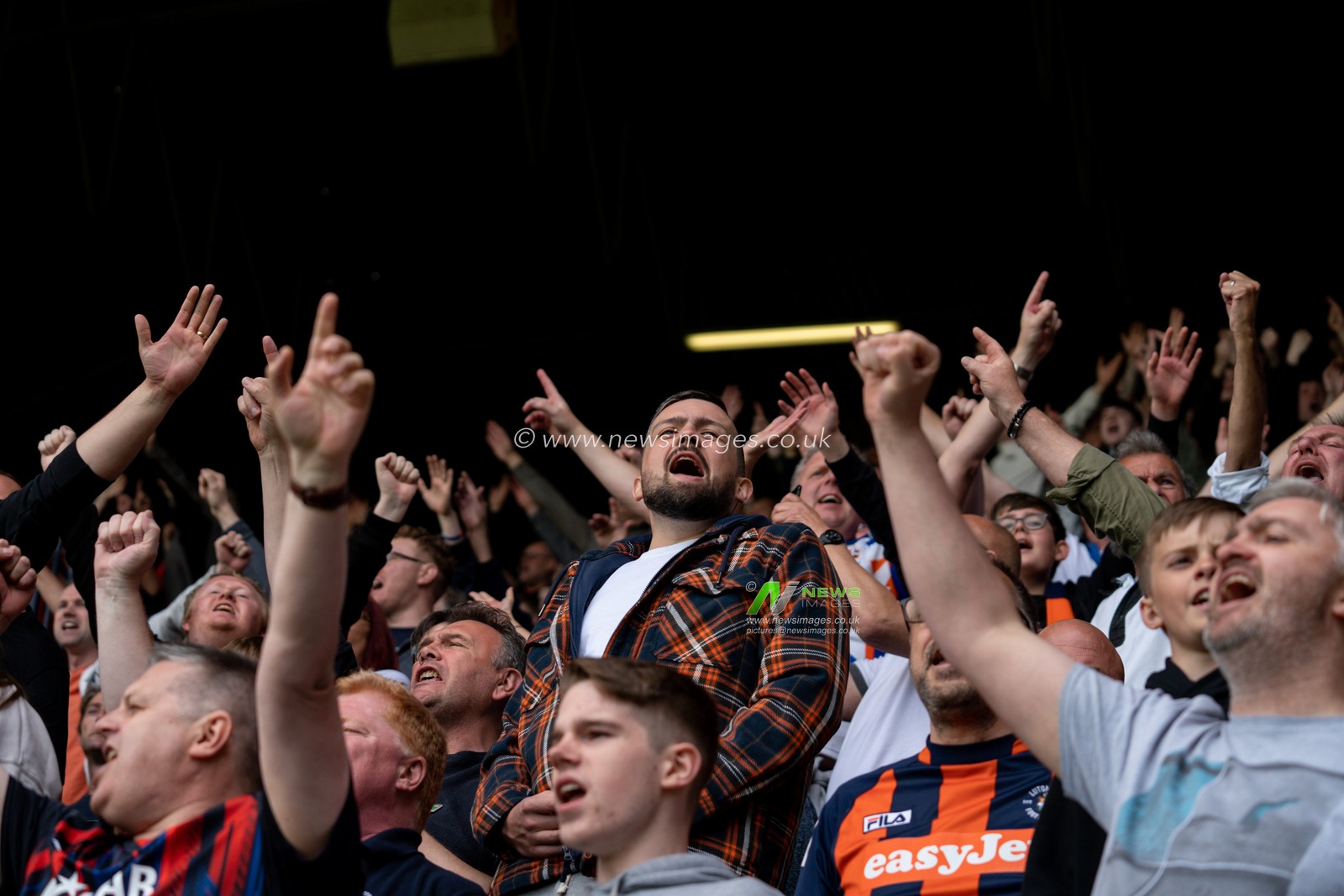 Fans celebrate winning the game 1:0 and making the playoffs
