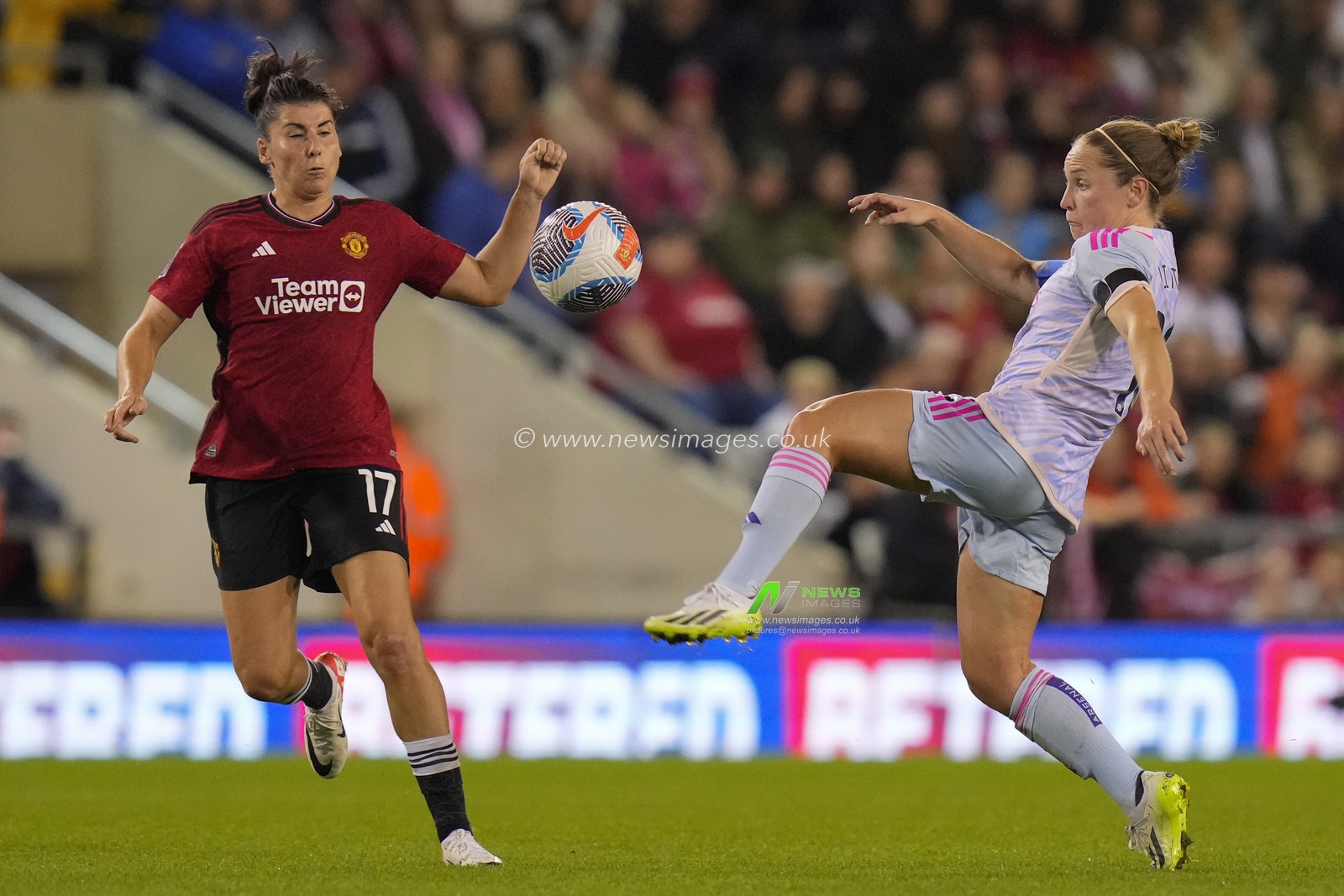 Lucia Garcia #17 of Manchester United competes for the ball with Kim Little #10 of Arsenal Women during the The FA Women's Super League match Manchester United Women vs Arsenal Women at Leigh Sports Village, Leigh, United Kingdom, 6th October 2023

(Photo by Steve Flynn/News Images)