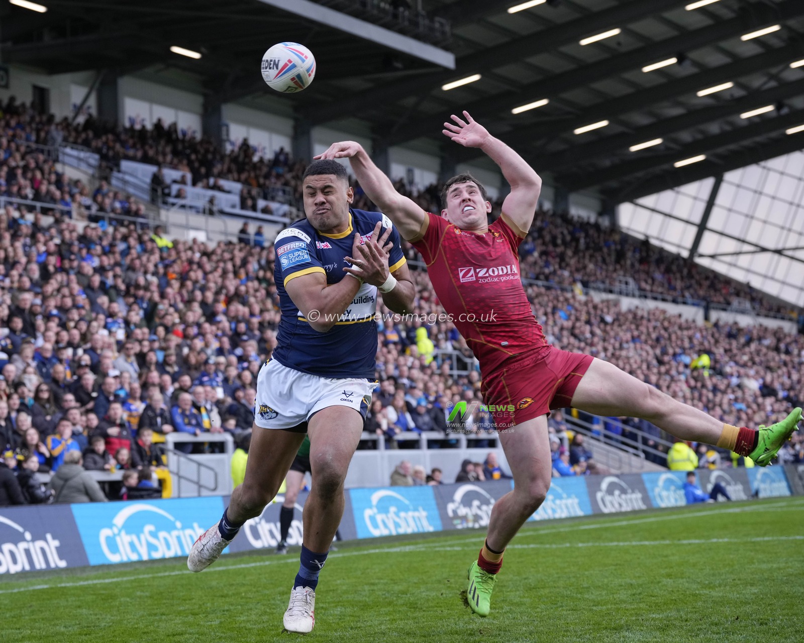 Matt Whitley #11 of Catalans Dragons and David Fusituâ€™a #2 of Leeds Rhinos compete for a high ball during the Betfred Super League Round 6 match Leeds Rhinos vs Catalans Dragons at Headingley Stadium, Leeds, United Kingdom, 25th March 2023

(Photo by Steve Flynn/News Images)