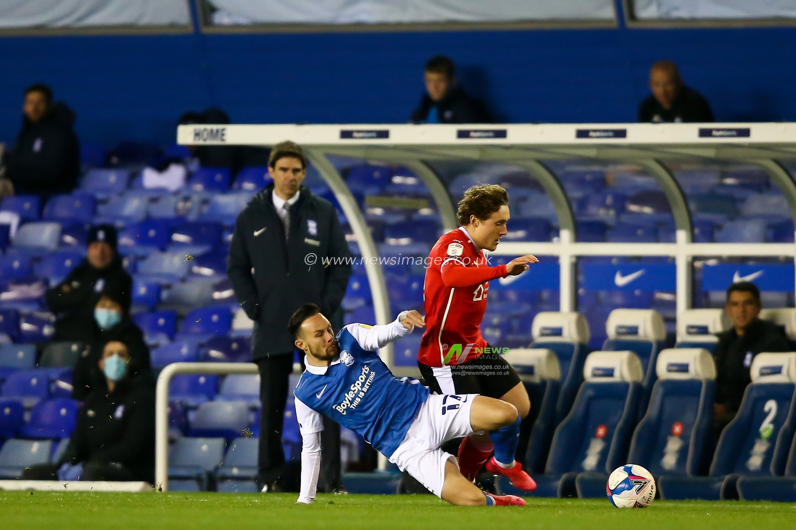Callum Styles #4 of Barnsley is tackled by Ivan Sanchez #17 of Birmingham City