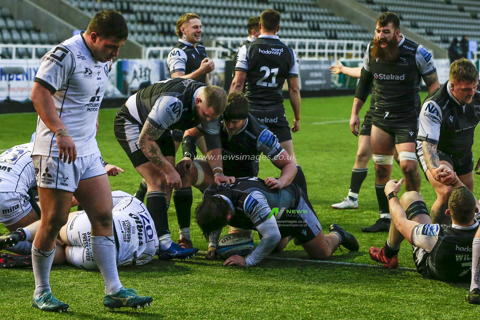 George McGuigan of Newcastle Falcons goes over for a try to make it 20-10