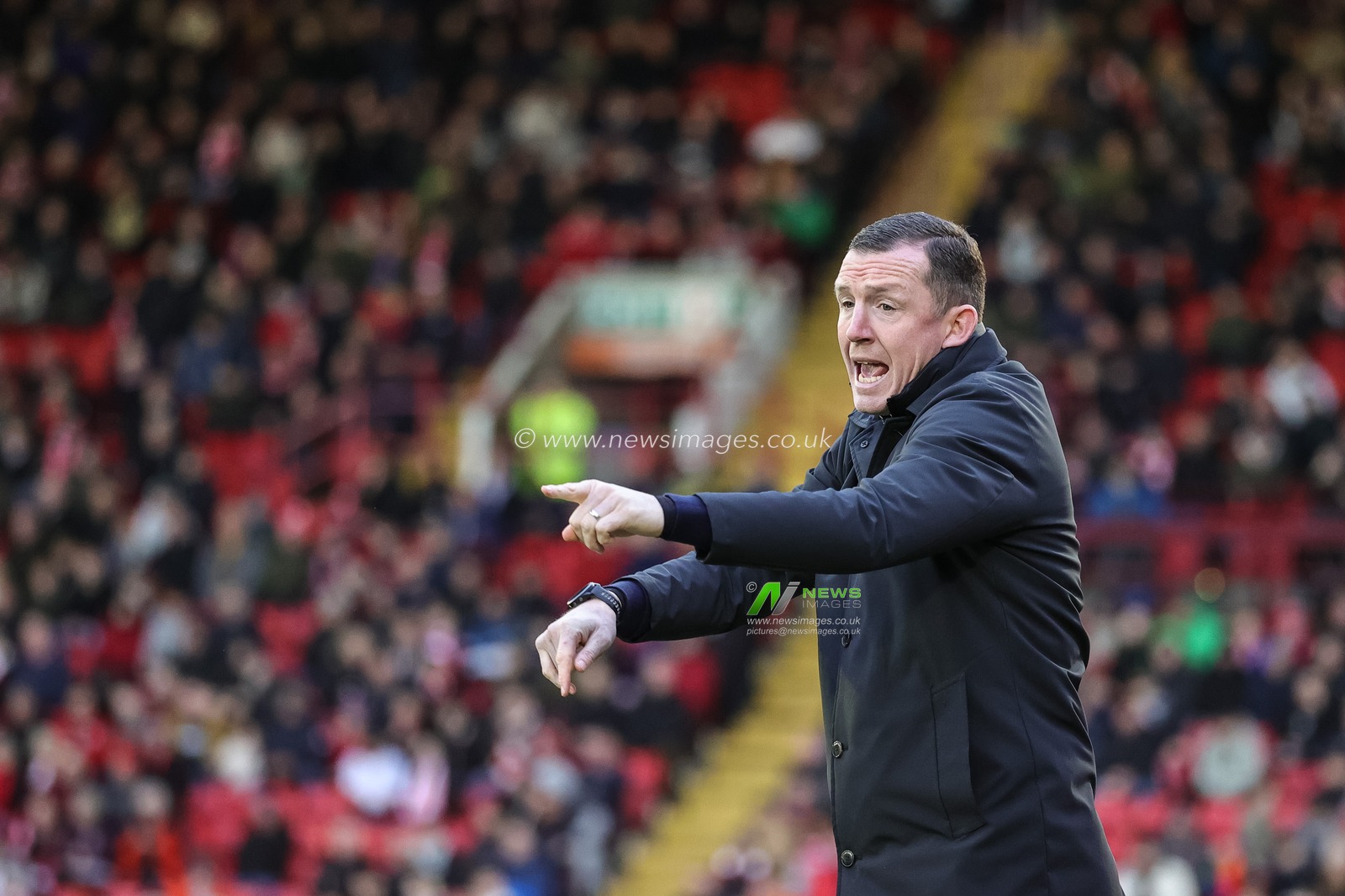 Neill Collins Head coach of Barnsley reacts in the technical area during the Sky Bet League 1 match Barnsley vs Wigan Athletic at Oakwell, Barnsley, United Kingdom, 1st January 2024

(Photo by Mark Cosgrove/News Images)