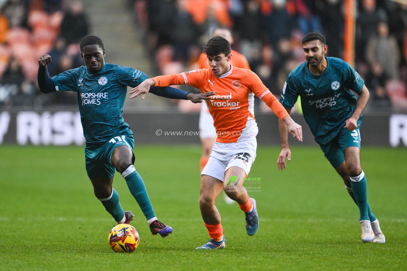 Charles Sagoe Junior of Shrewsbury Town and Rob Apter of Blackpool battle for the ball during the Sky Bet League 1 match Blackpool vs Shrewsbury Town at Bloomfield Road, Blackpool, United Kingdom, 1st January 2025

(Photo by Craig Thomas/News Images)