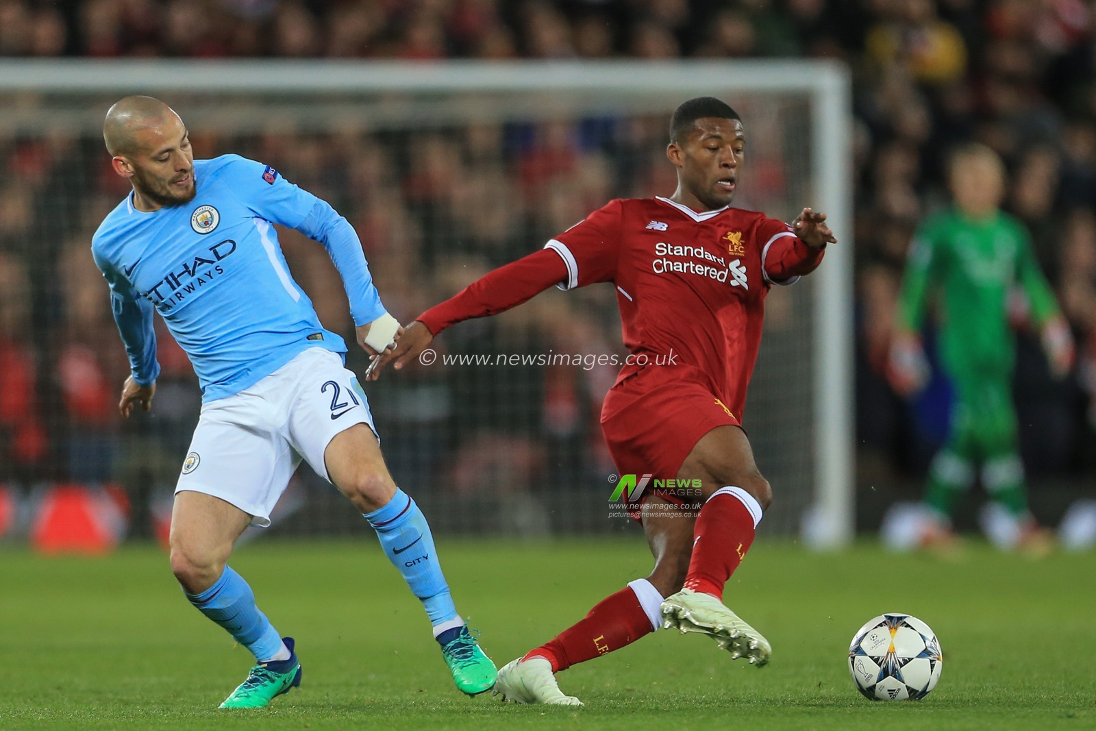 4th April 2018 , Anfield, Liverpool, England; Champions League Quarter Final, first leg, Liverpool v Manchester City; Georginio Wijnaldum of Liverpool slips David Silva of Manchester City