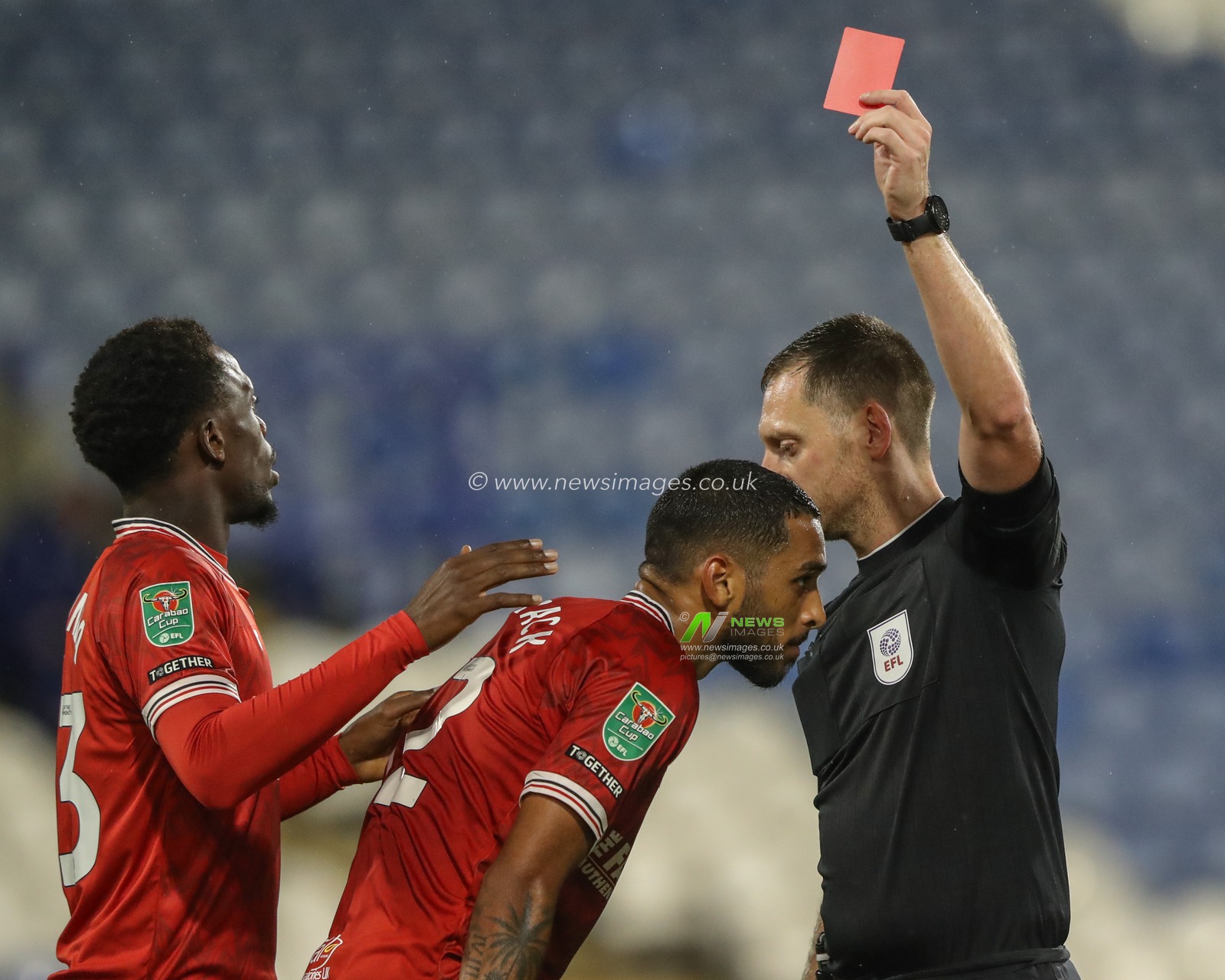 Referee Simon Mather gives a red card to Kayden Harrack of Morecambe during the Carabao Cup match Huddersfield Town vs Morecambe at John Smith's Stadium, Huddersfield, United Kingdom, 13th August 2024

(Photo by Alfie Cosgrove/News Images)