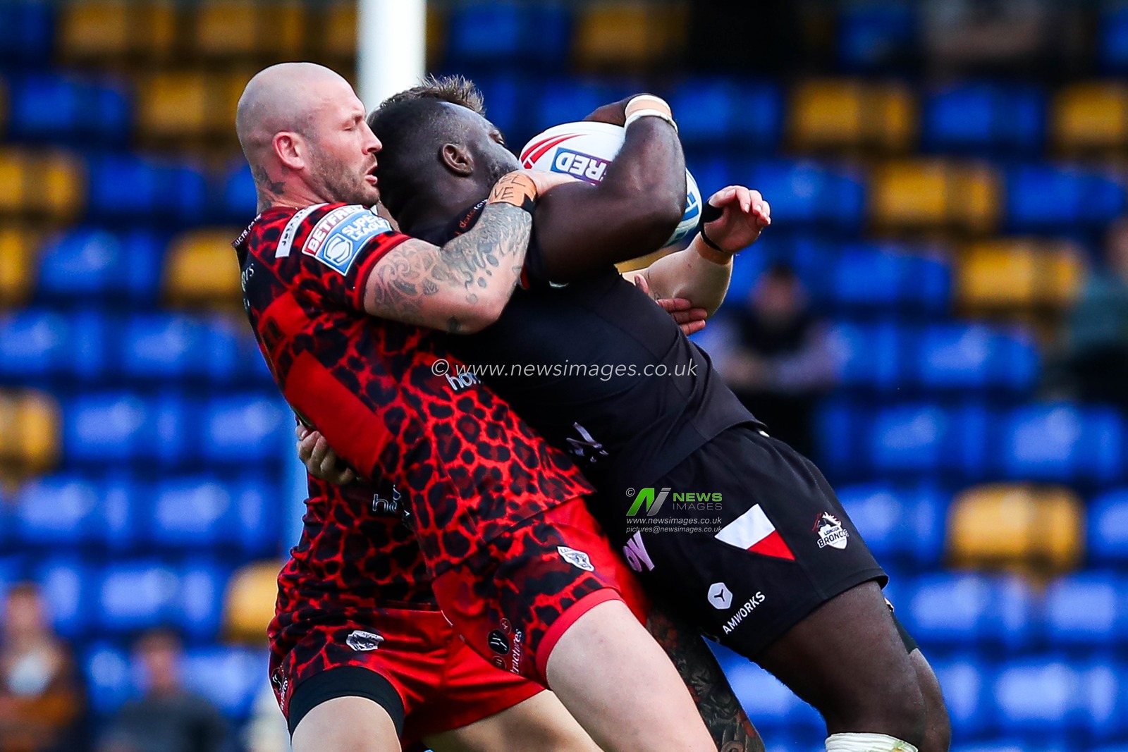 Zak Hardaker of Leigh Leopards tackles Sadiq Adebiyi of London Broncos during the Betfred Super League Round 23 match London Broncos vs Leigh Leopards at Plough Lane, Wimbledon, United Kingdom, 25th August 2024

(Photo by Izzy Poles/News Images)