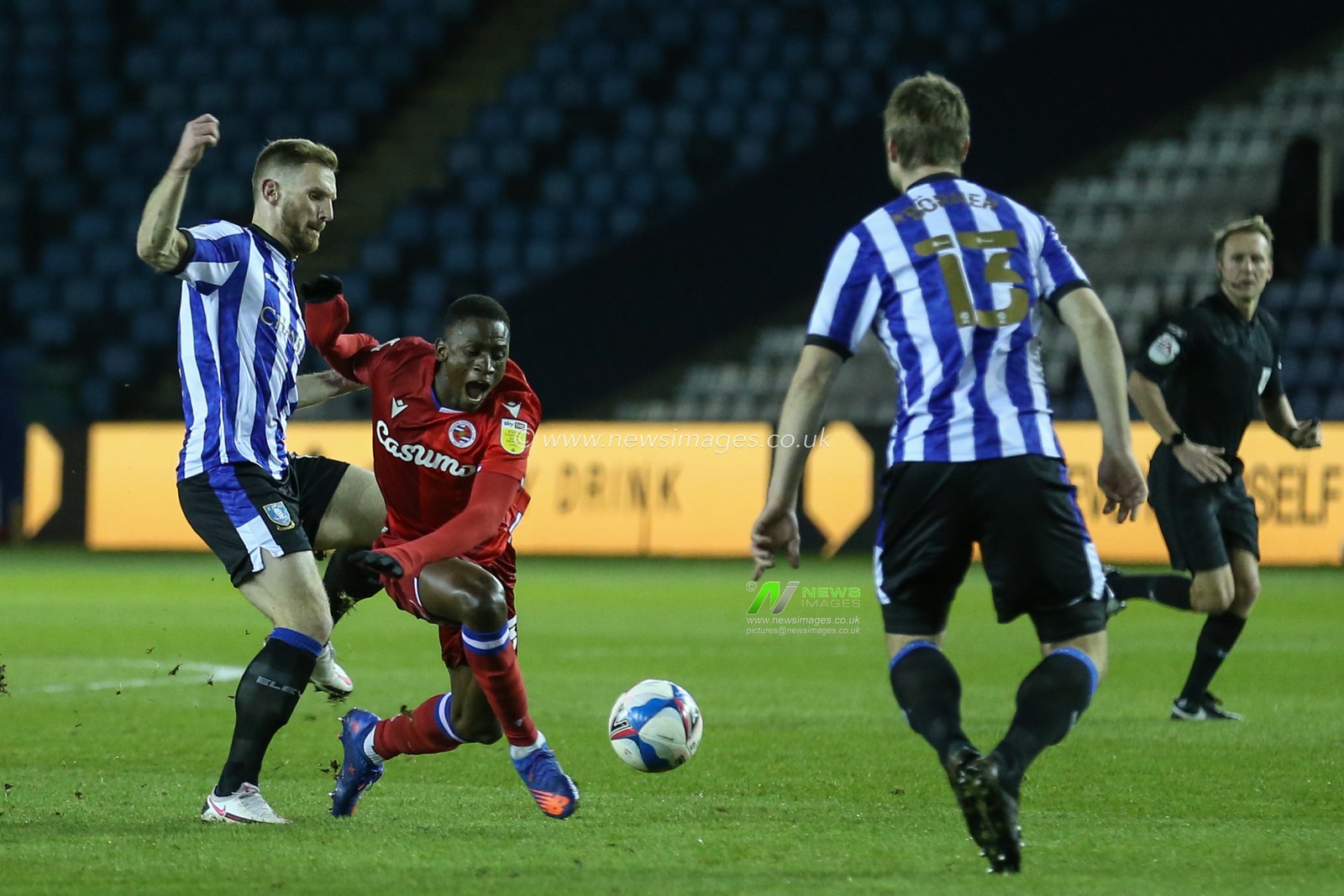 Tom Lees #15 of Sheffield Wednesday fouls Alfa Semedo #30 of Reading