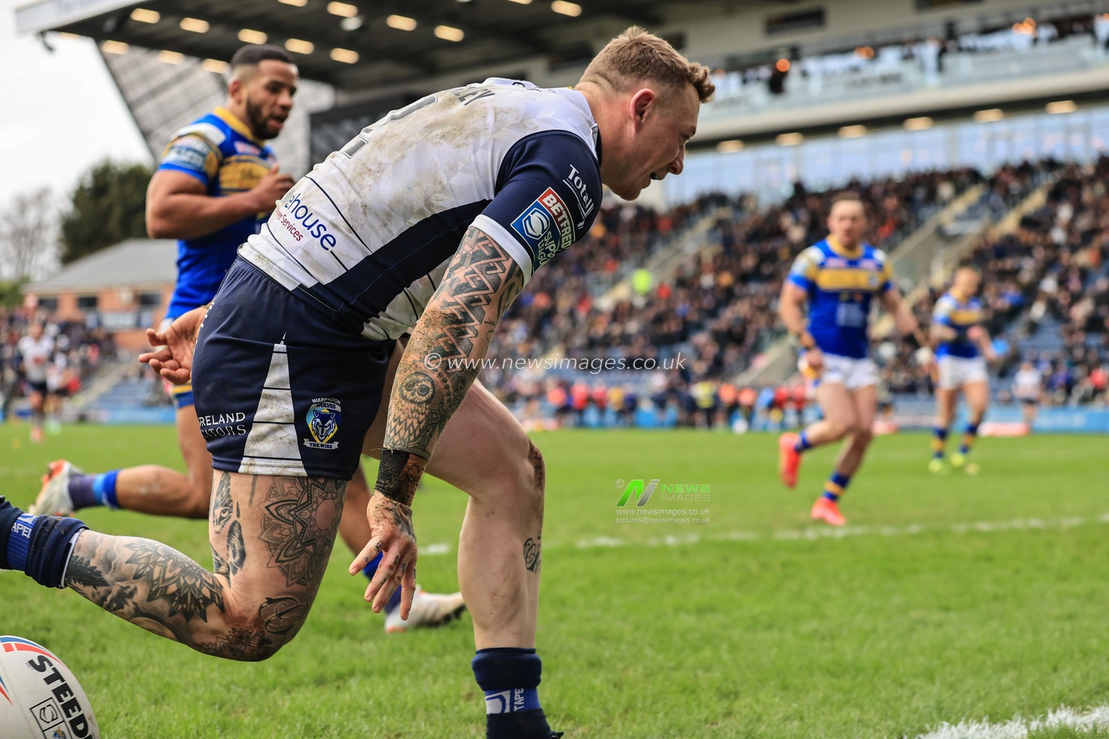 Josh Charnley #2 of Warrington Wolves goes over for a try