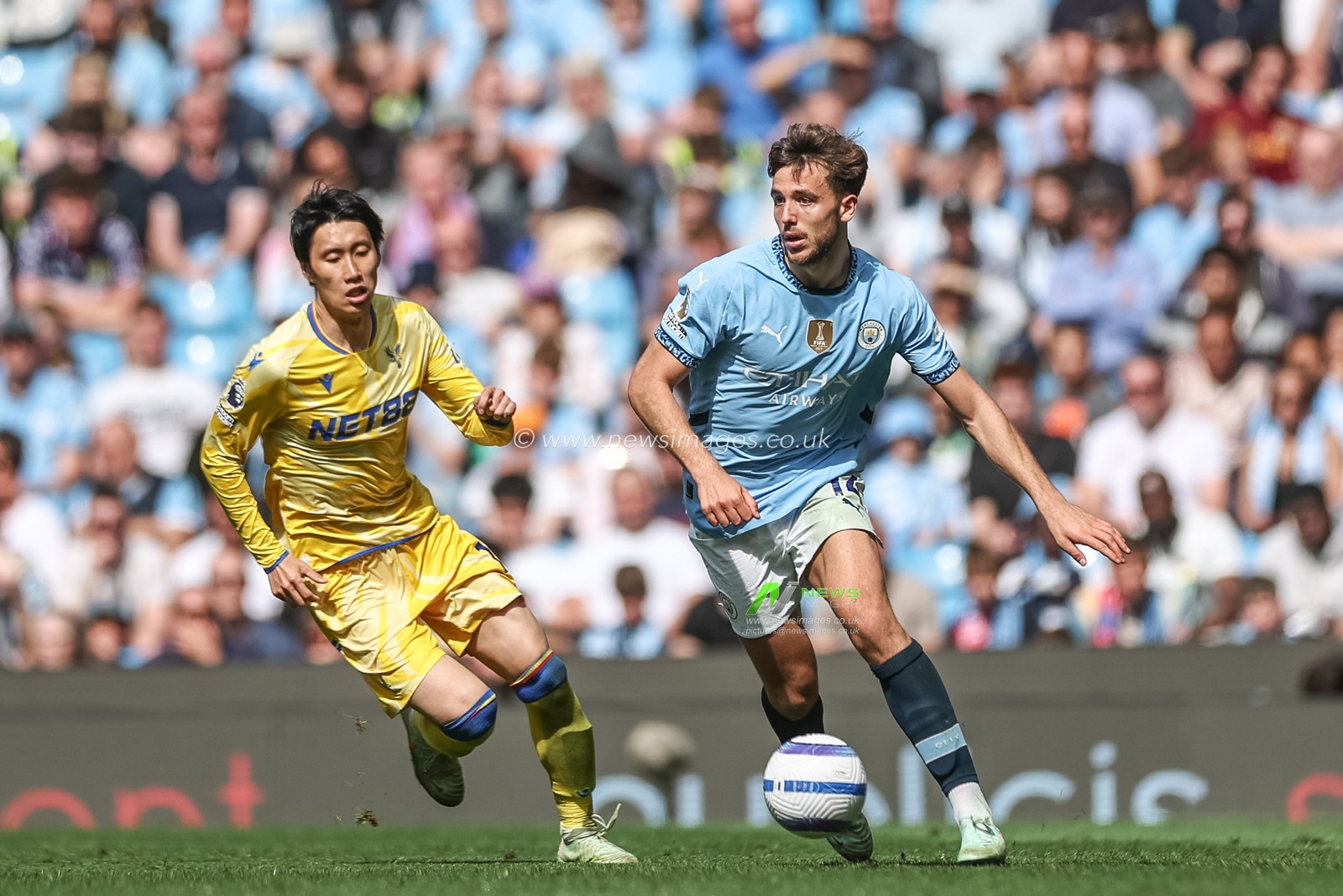 Nico GonzÃ¡lez of Manchester City breaks with the ball during the Premier League match Manchester City vs Crystal Palace at Etihad Stadium, Manchester, United Kingdom, 12th April 2025

(Photo by Mark Cosgrove/News Images)