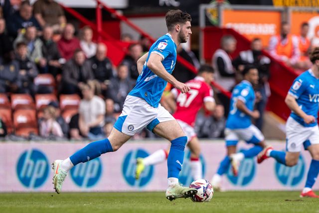Stockport County's Ethan Pye carries the ball during the Sky Bet League 1 match Wrexham vs Stockport County at SToK Cae Ras, Wrexham, United Kingdom, 22nd March 2025

(Photo by Nik Mesney/News Images)