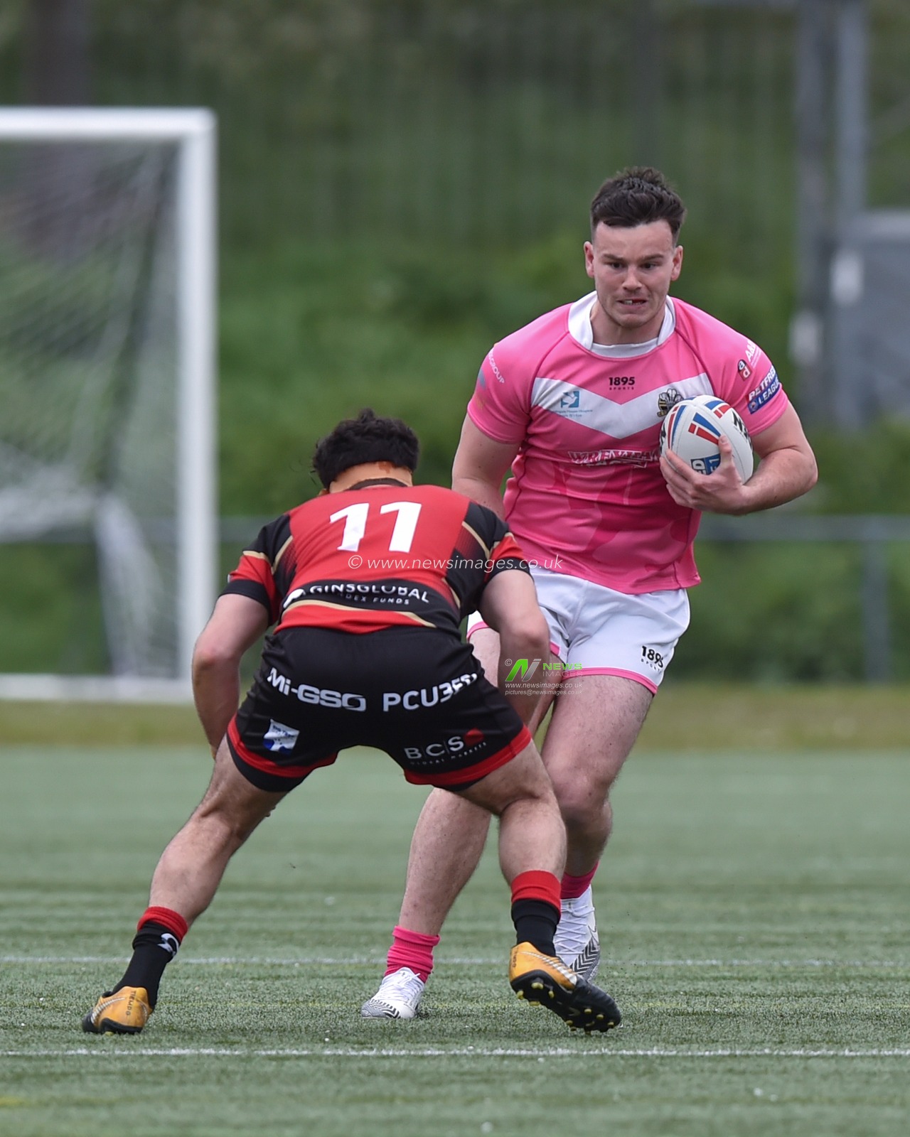 Alex Eckley of North Wales Crusaders  ahead of Adam Vrahnos of London Skolars