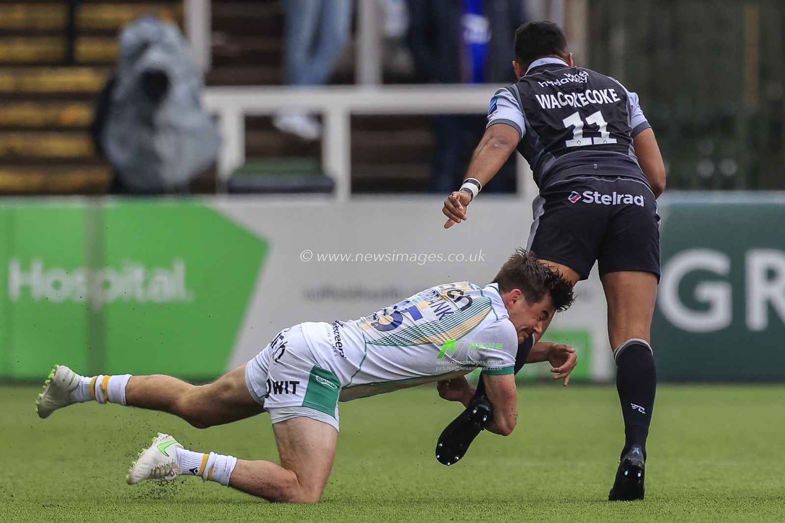 George Furbank of Northampton Saints tackles George Wacokecoke of Newcastle Falcons