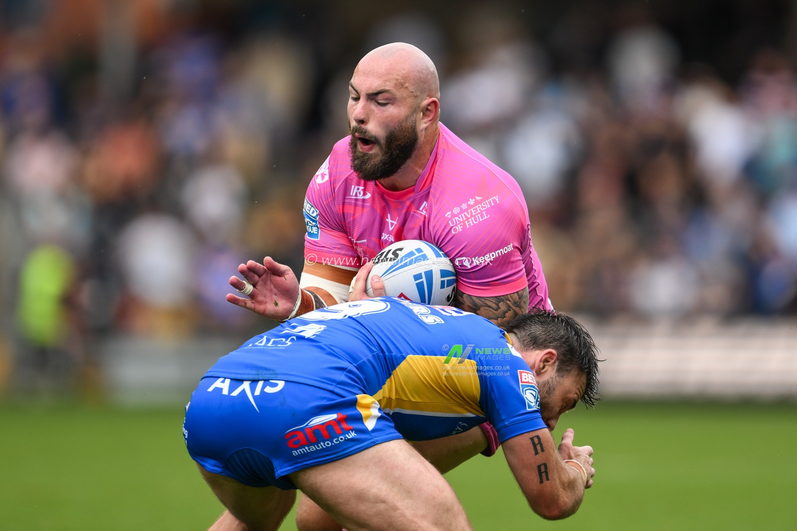 Sam Luckley of Hull KR is tackled by Andy Ackers of Leeds Rhinos  during the Betfred Super League Round 18 match Leeds Rhinos vs Hull KR at Headingley Stadium, Leeds, United Kingdom, 20th July 2024

(Photo by Craig Thomas/News Images)