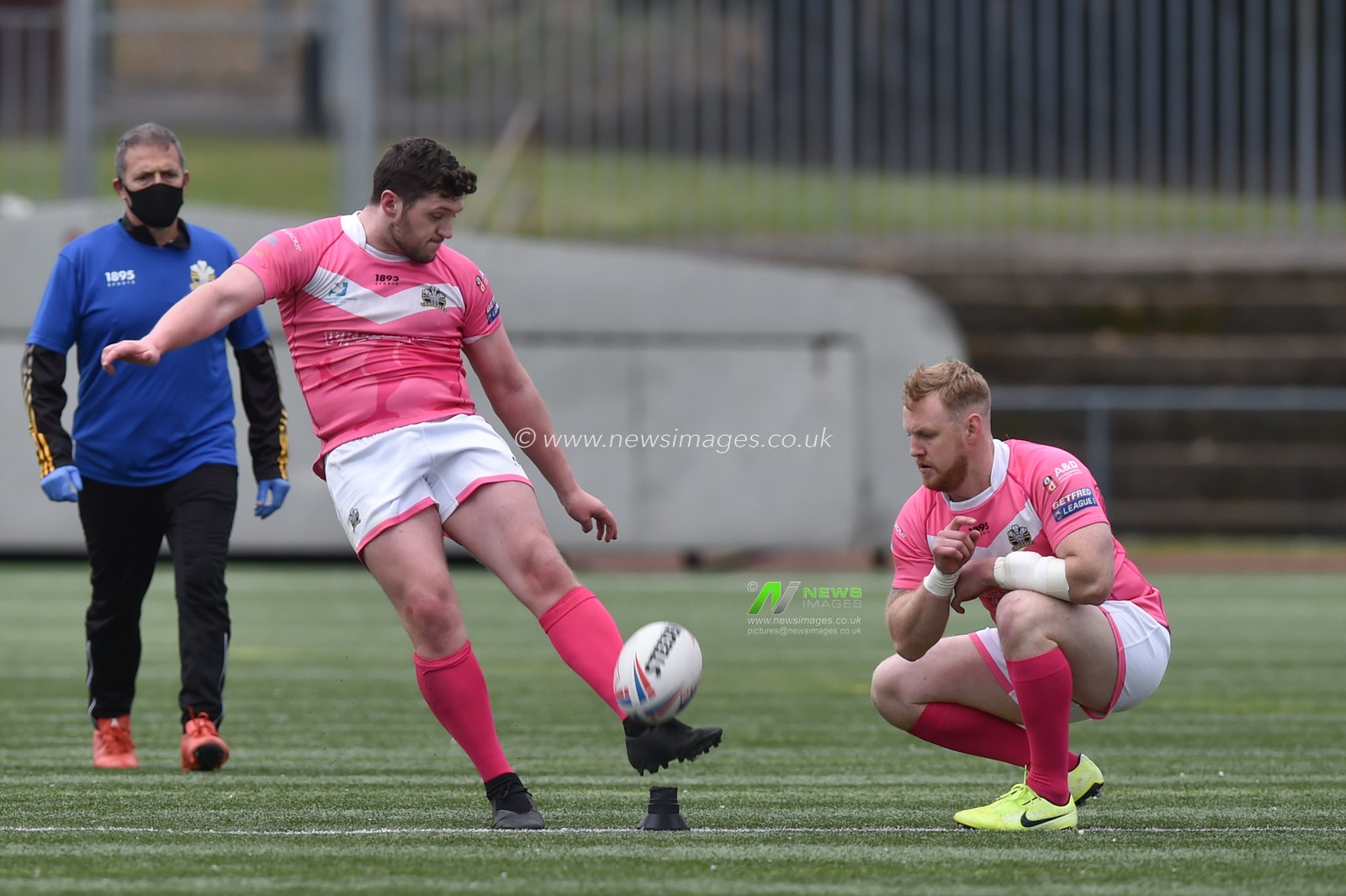 Jack Holmes of North Wales Crusaders restarts the game