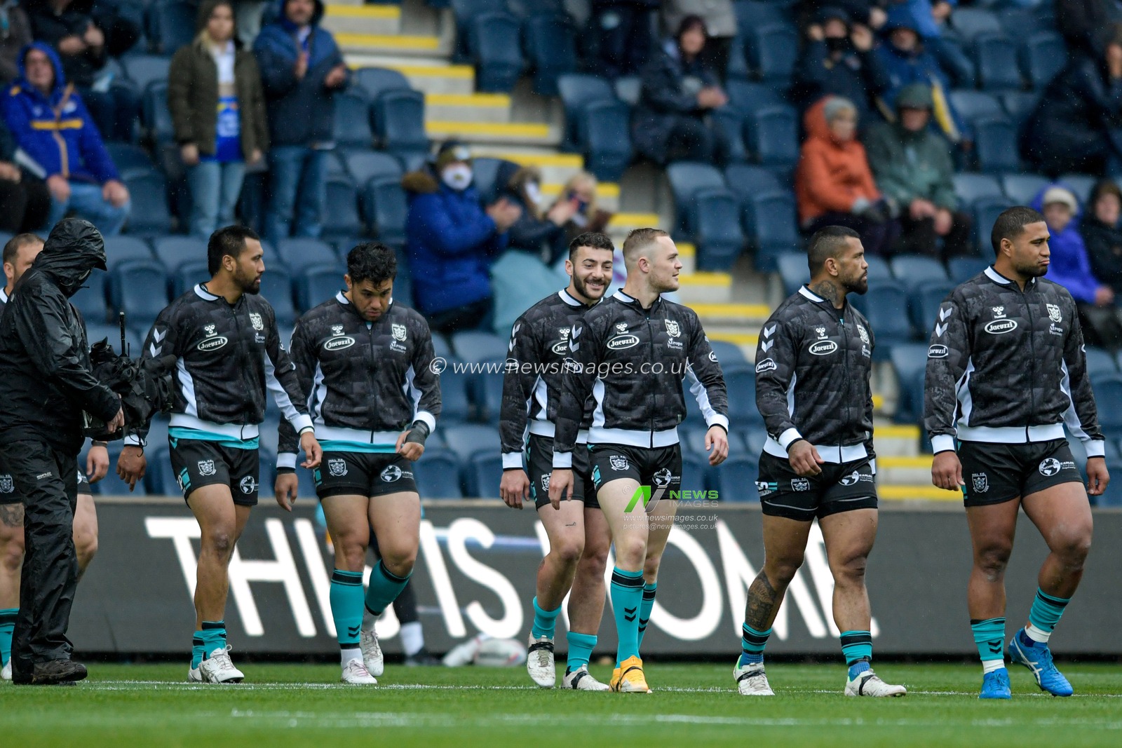 The Hull FC players enter the pitch before the game