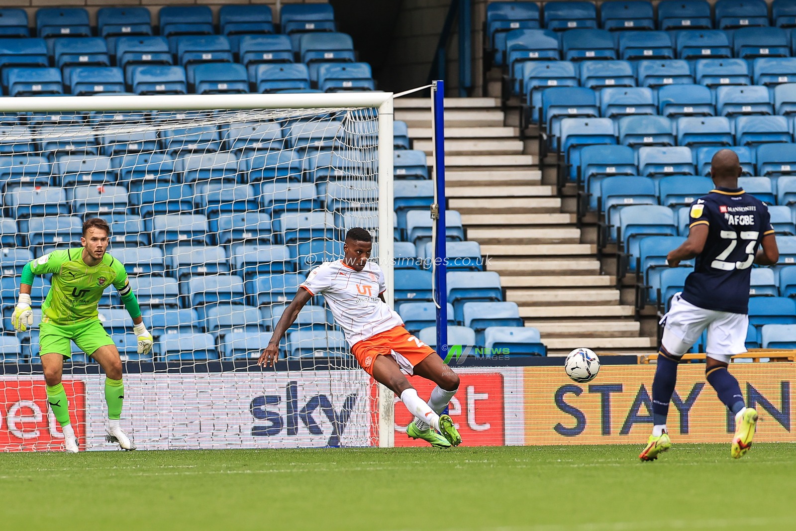 Marvin Ekpiteta #21 of Blackpool clears the ball from infront of goal