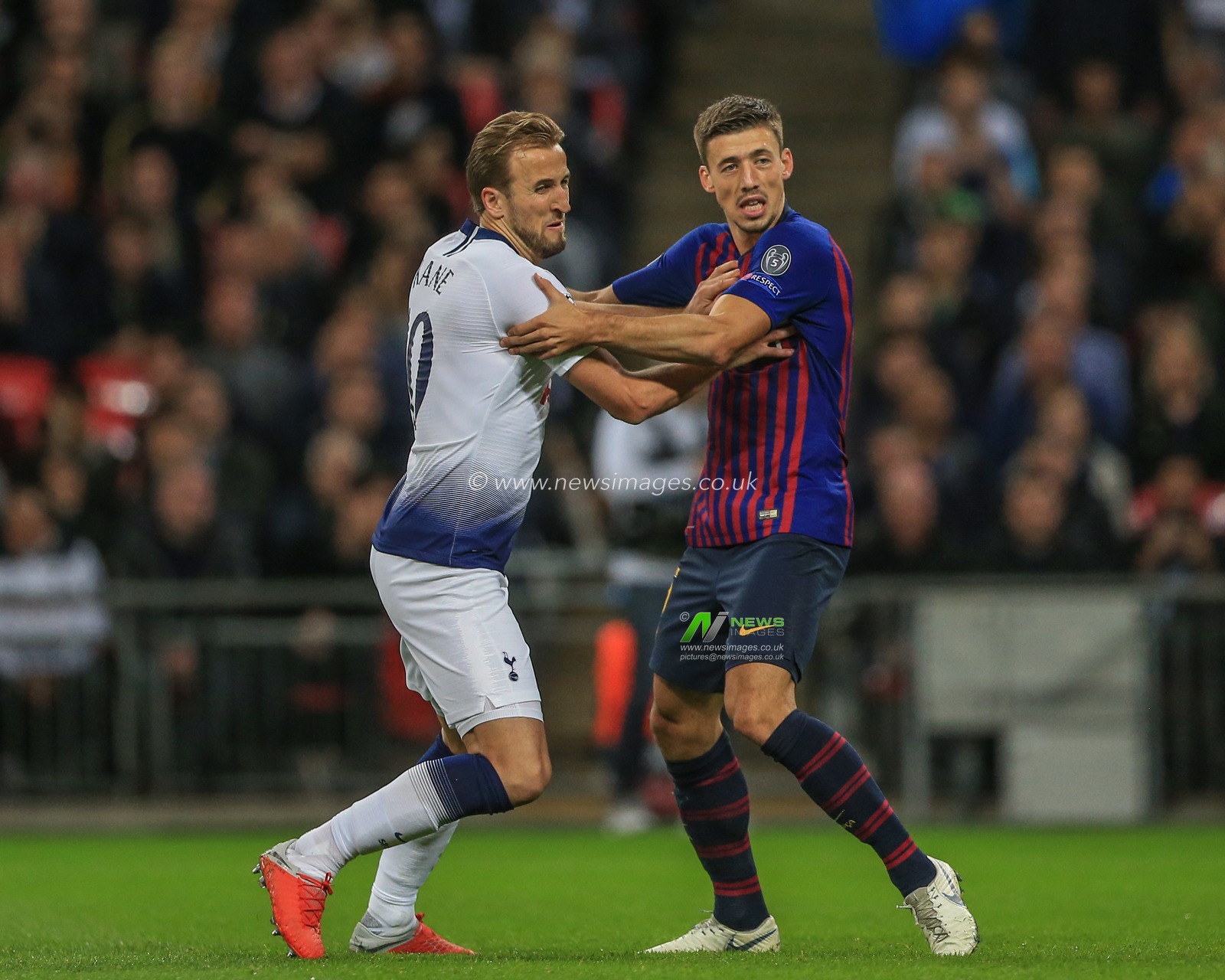 3rd October 2018, Wembley Stadium, London, England; UEFA Champions League, Tottenham v Barcelona ;  Harry Kane (10) of Tottenham and Clement Lenglet (15) of Barcelona tussle for the ball

Credit: Mark Cosgrove/News Images