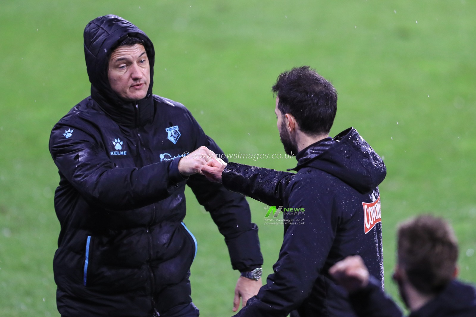 Vladimir IviÄ‡ manager of Watford fist bumps Carlos CorberÃ¡n manager of Huddersfield Town after Huddersfield win 2-0