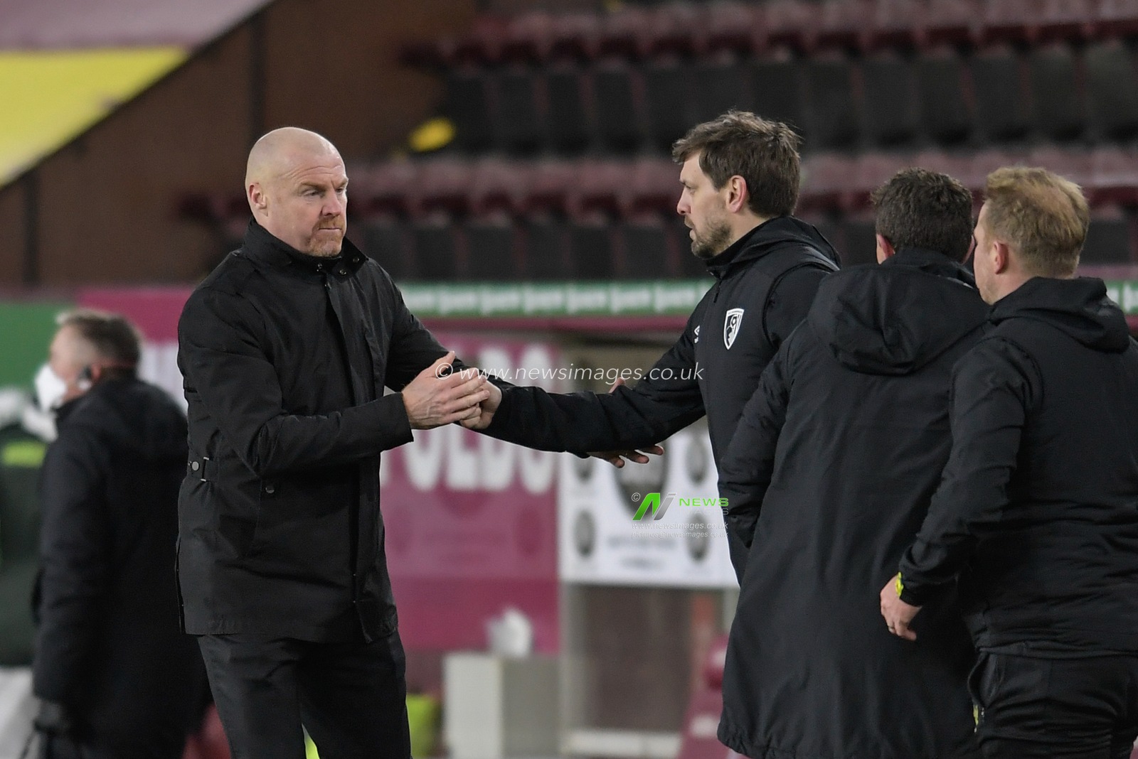 Sean Dyche manager of Burnley congratulates Jonathan Woodgate manager of Bournemouth after Bournemouth win 0-2