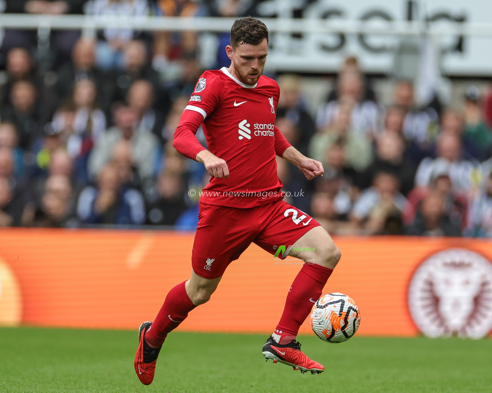 Andrew Robertson #26 of Liverpool breaks with the ball during the Premier League match Newcastle United vs Liverpool at St. James's Park, Newcastle, United Kingdom, 27th August 2023

(Photo by Mark Cosgrove/News Images)