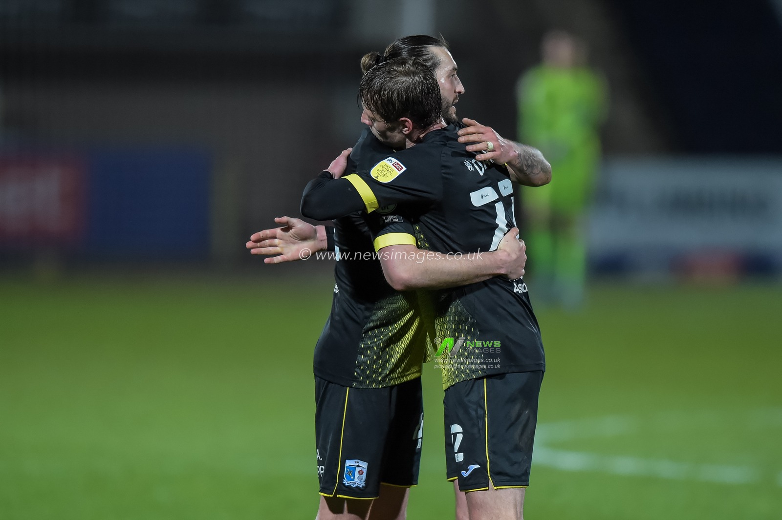 Barrow players Josh Kay #11 of Barrow and Jason Taylor #4 of Barrow congratulate each other after the final whistle