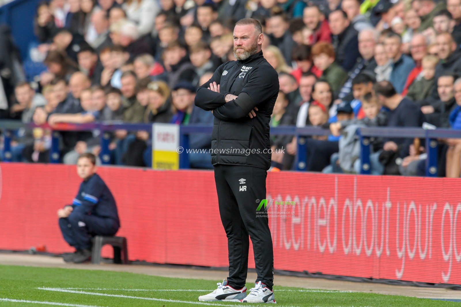 Wayne Rooney manager of Derby County watches the game from the technical area