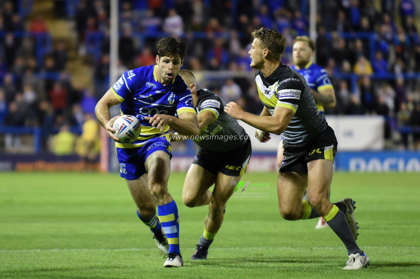 6th September 2019 , Halliwell Jones Stadium, Warrington, England;  Betfred Super League Rugby, Round 28, Warrington Wolves vs Wakefield Trinity ; Jake Mamo (22) of Warrington Wolves escapes the tackle of Ryan Hampshire (1) of Wakefield Trinity

Credit: Richard Long/News Images