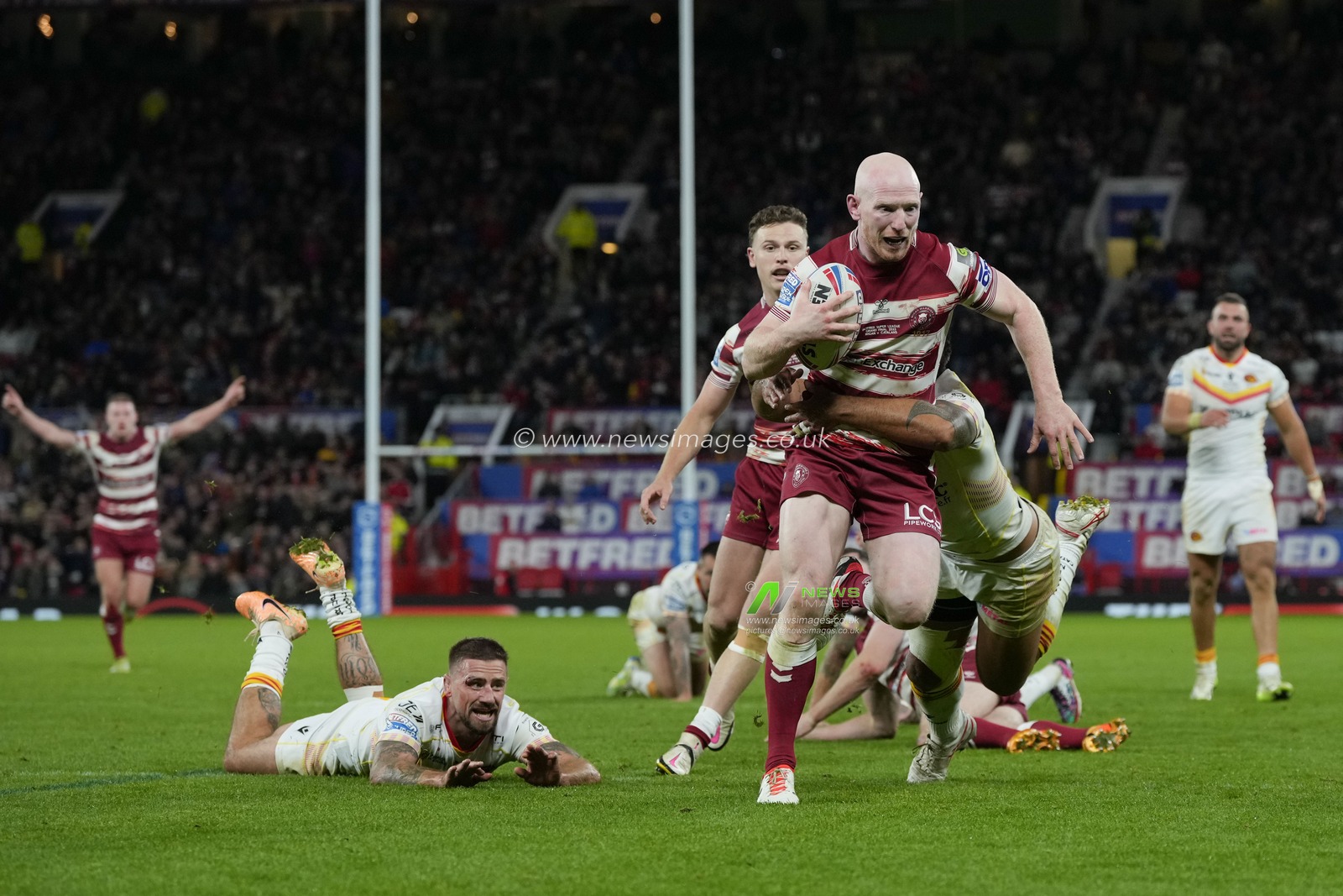 Liam Farrell #12 of Wigan Warriors makes a break during the Betfred Super League Grand Final match Wigan Warriors vs Catalans Dragons at Old Trafford, Manchester, United Kingdom, 14th October 2023

(Photo by Steve Flynn/News Images)