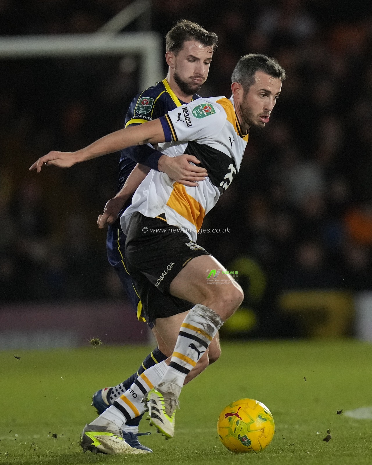 Dan Barlaser #4 of Middlesbrough competes for the ball with Ben Garrity of Port Vale during the Carabao Cup Quarter Final match Port Vale vs Middlesbrough at Vale Park, Burslem, United Kingdom, 19th December 2023

(Photo by Steve Flynn/News Images)