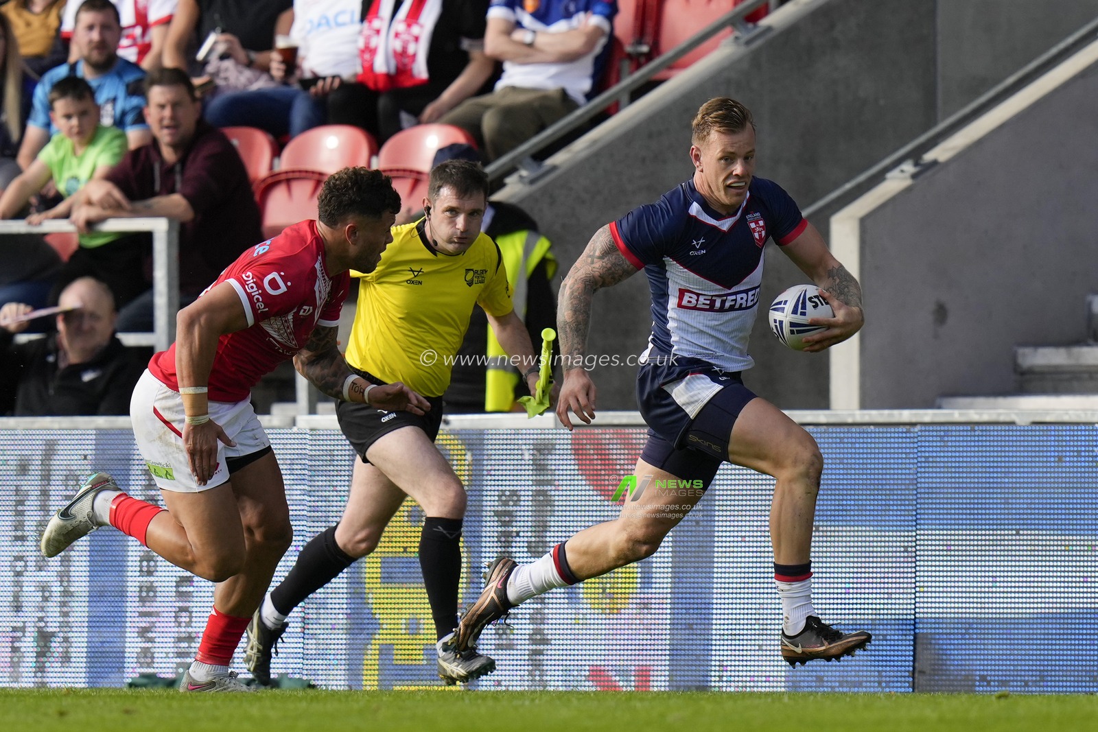 Tom Johnstone #5 of England makes a break during the Rugby League International match England vs Tonga at Totally Wicked Stadium, St Helens, United Kingdom, 22nd October 2023

(Photo by Steve Flynn/News Images)