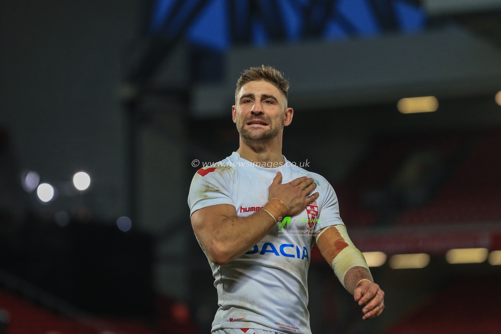4th November, Anfield, Liverpool, England ; Rugby League International Test Match , England v New Zealand ;  Tommy Makinson of England and scorer of two try's puts his hand on his England badge



Credit:  Mark Cosgrove/News Images