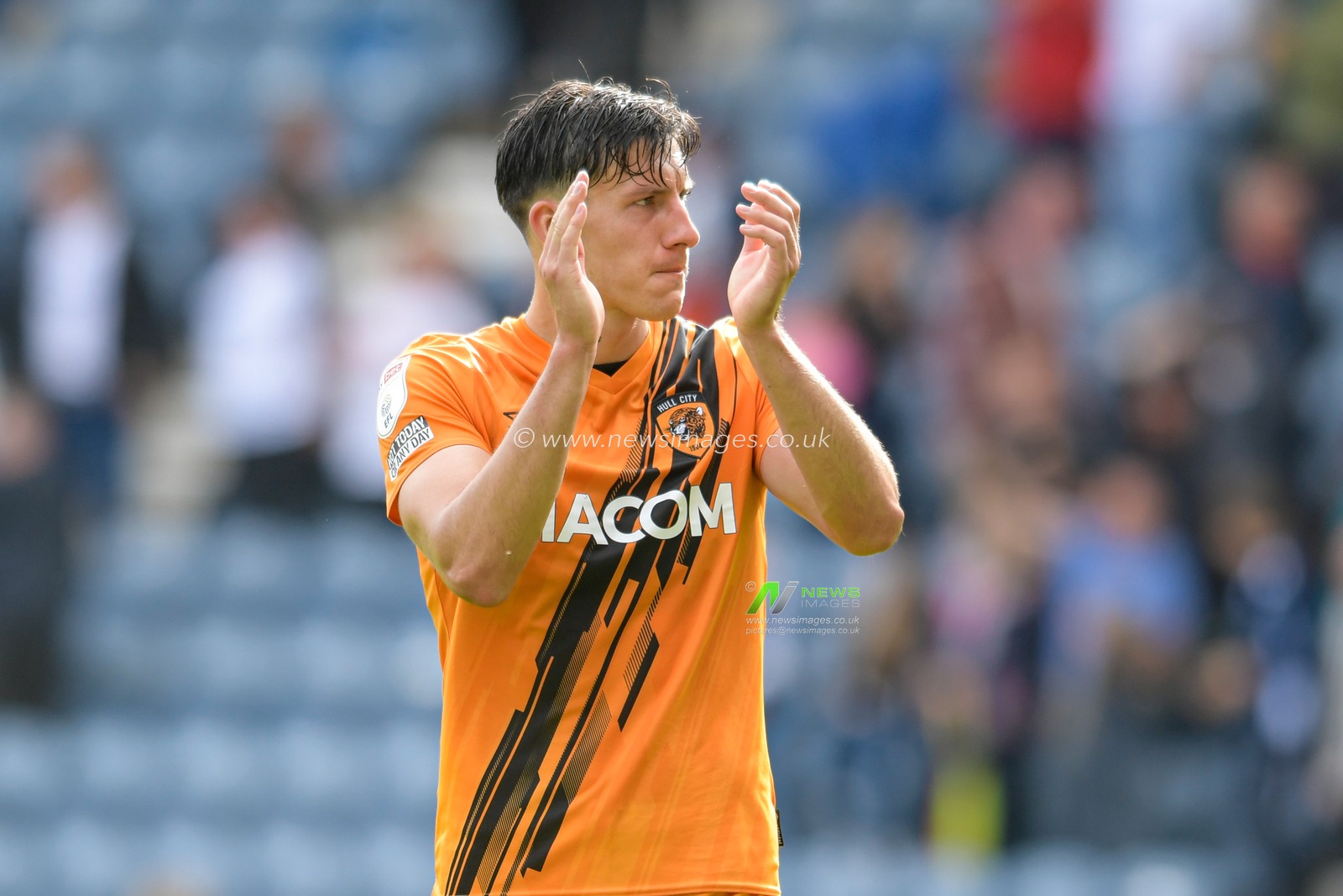 Alfie Jones #5 of Hull City applauds the travelling supporters at the end of the game after beating Preston North End 1-4