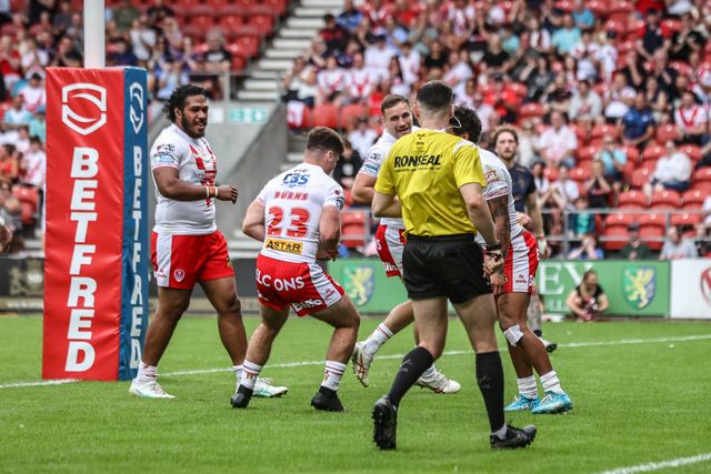 Jake Burns of St. Helens passes the ball to his teammate Jake Burns of St. Helens so he can have the try during the Betfred Super League round 16 match St Helens vs Salford Red Devils at Totally Wicked Stadium, St Helens, United Kingdom, 29th June 2025

(Photo by Alfie Cosgrove/News Images)