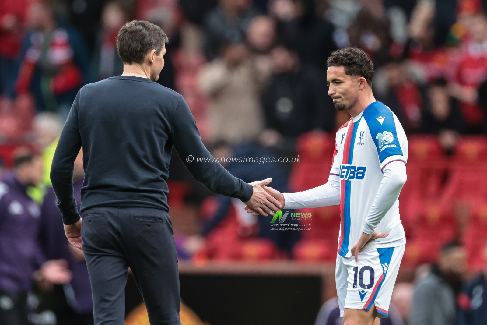 Oliver Glasner manager of Crystal Palace shakes hands with Yeremi Pino of Crystal Palace during the Premier League match Manchester United vs Crystal Palace at Old Trafford, Manchester, United Kingdom on 01 March 2026

(Photo by Mark Cosgrove/News Images)