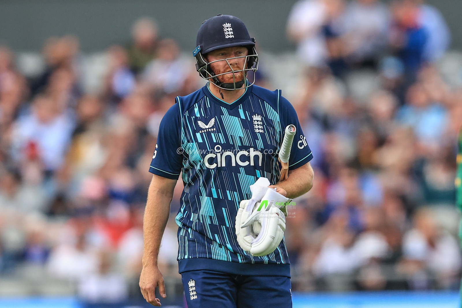 A dejected Jonny Bairstow of England leaves the field after heâ€™s bowled out by Dwaine Pretorius of South Africa