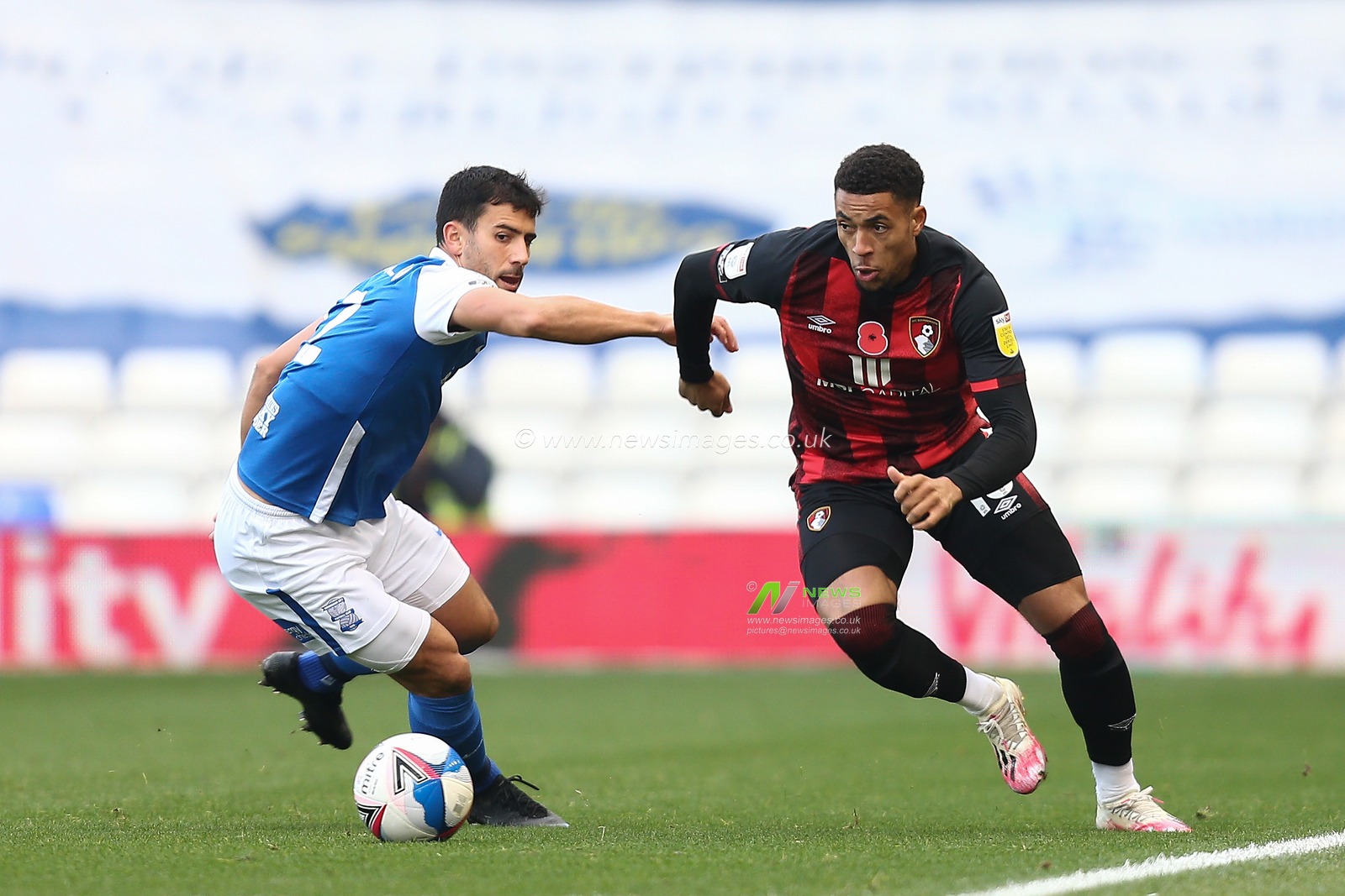 Arnaut Danjuma #10 of Bournemouth dribbles the ball past Maxime Colin #2 of Birmingham City