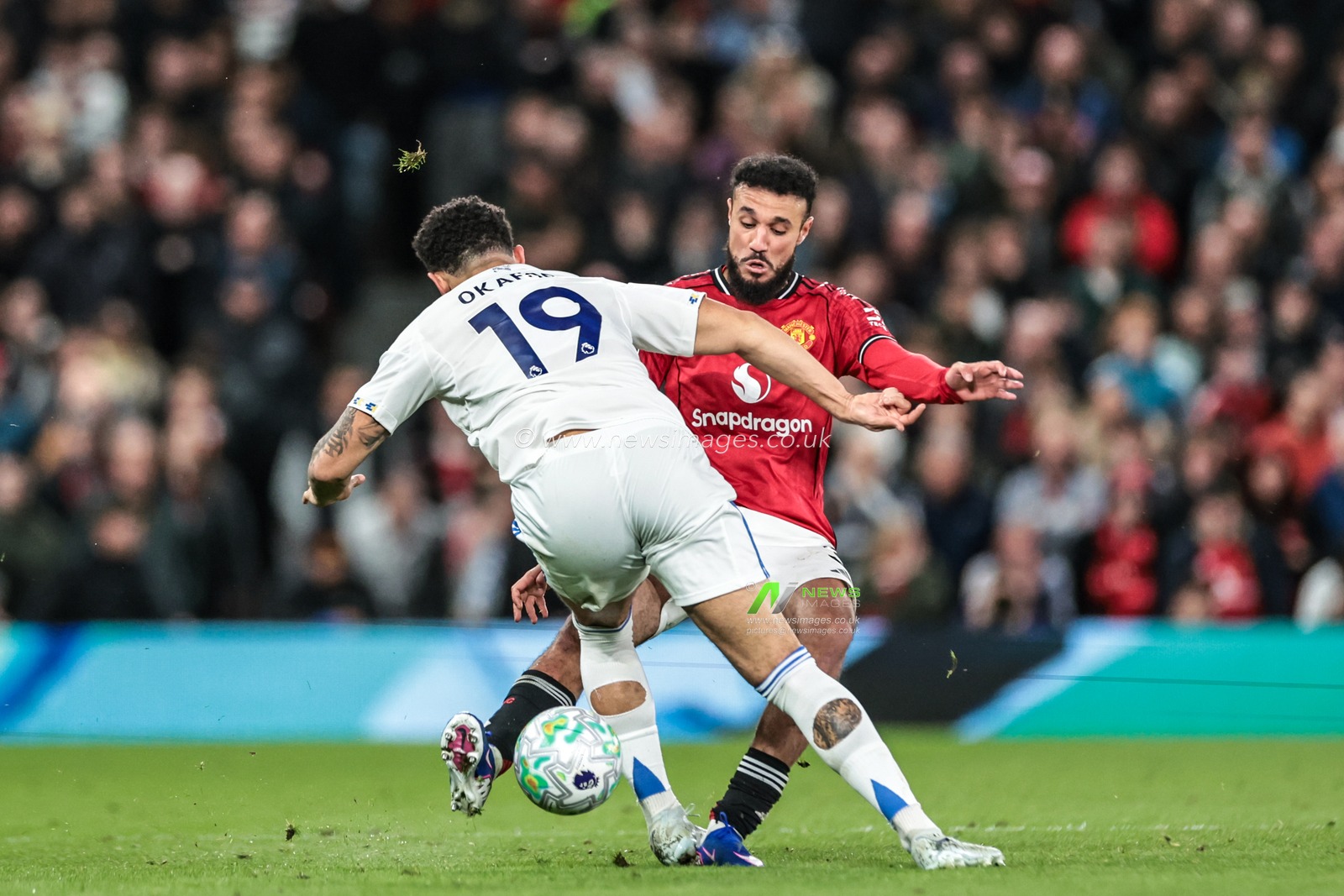 Noah Okafor of Leeds United and Noussair Mazraoui of Manchester United battle for the ball during the Premier League match Manchester United vs Leeds United at Old Trafford, Manchester, United Kingdom on 13 April 2026

(Photo by Mark Cosgrove/News Images)