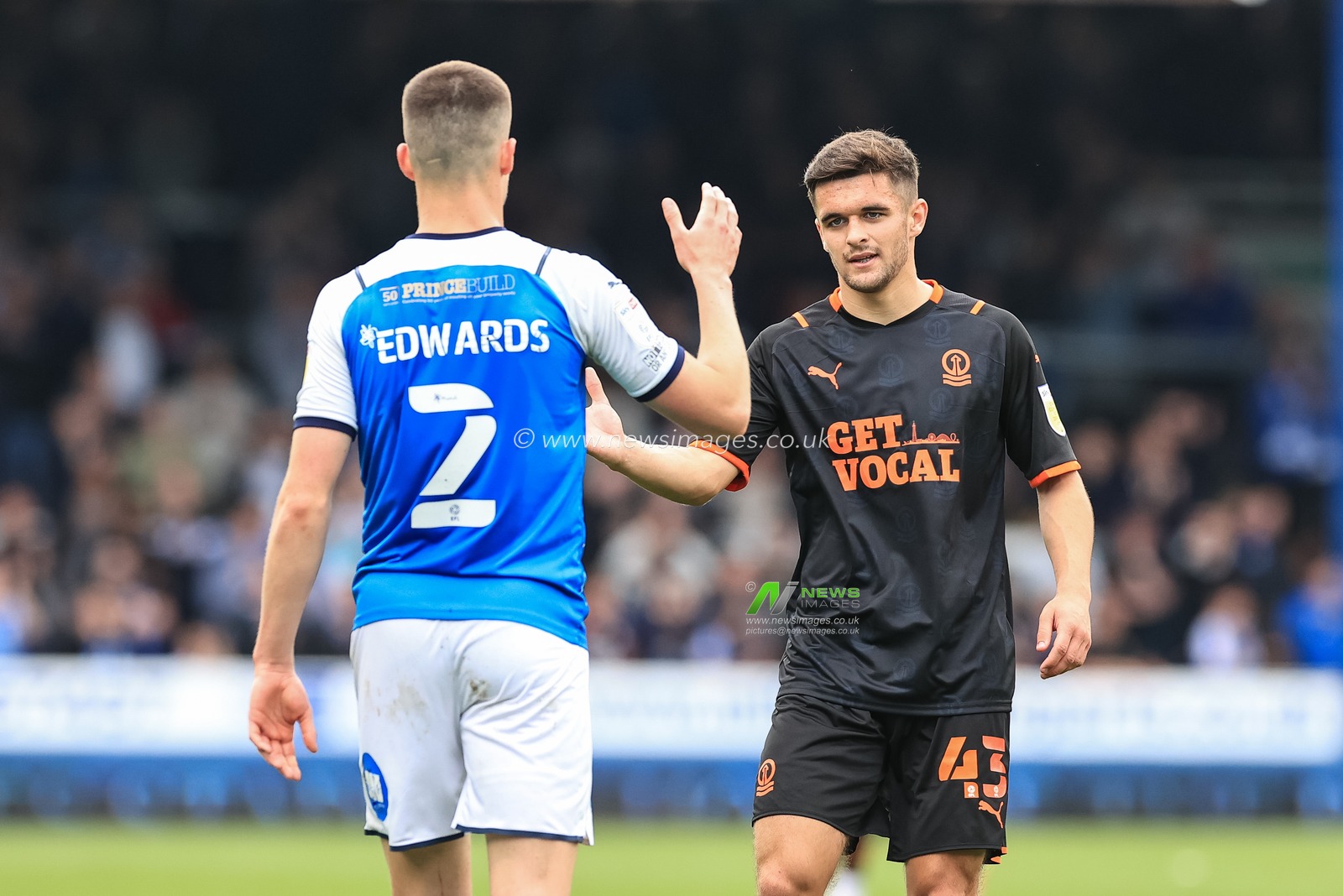 Jake Daniels #43 of Blackpool shakes pads with Ronnie Edwards #2 of Peterborough United after the game