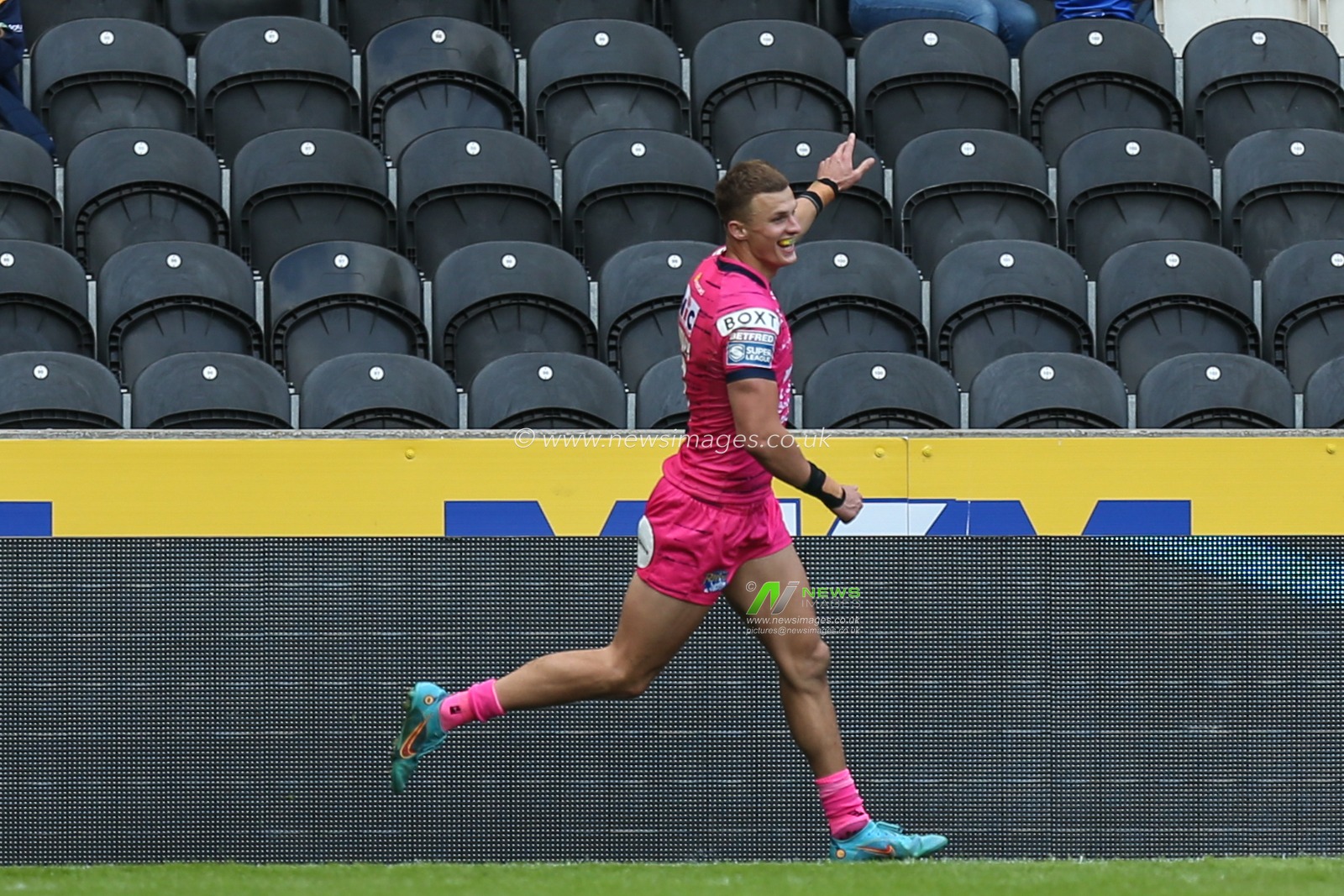 Ash Handley #5 of Leeds Rhinos celebrates his 5th try of the match to make it 16-60