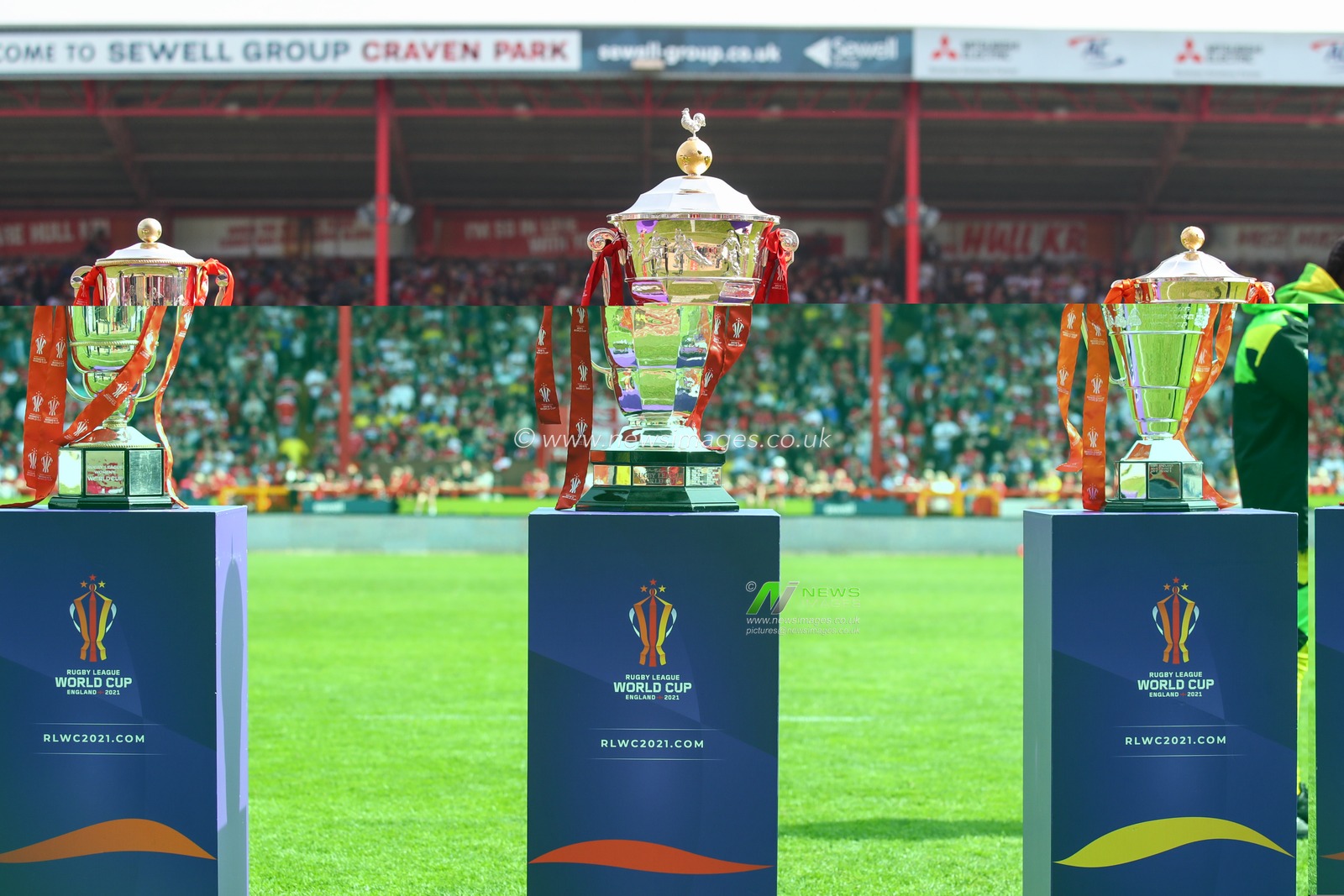 The Rugby League World Cup trophies are displayed on the pitch at half time