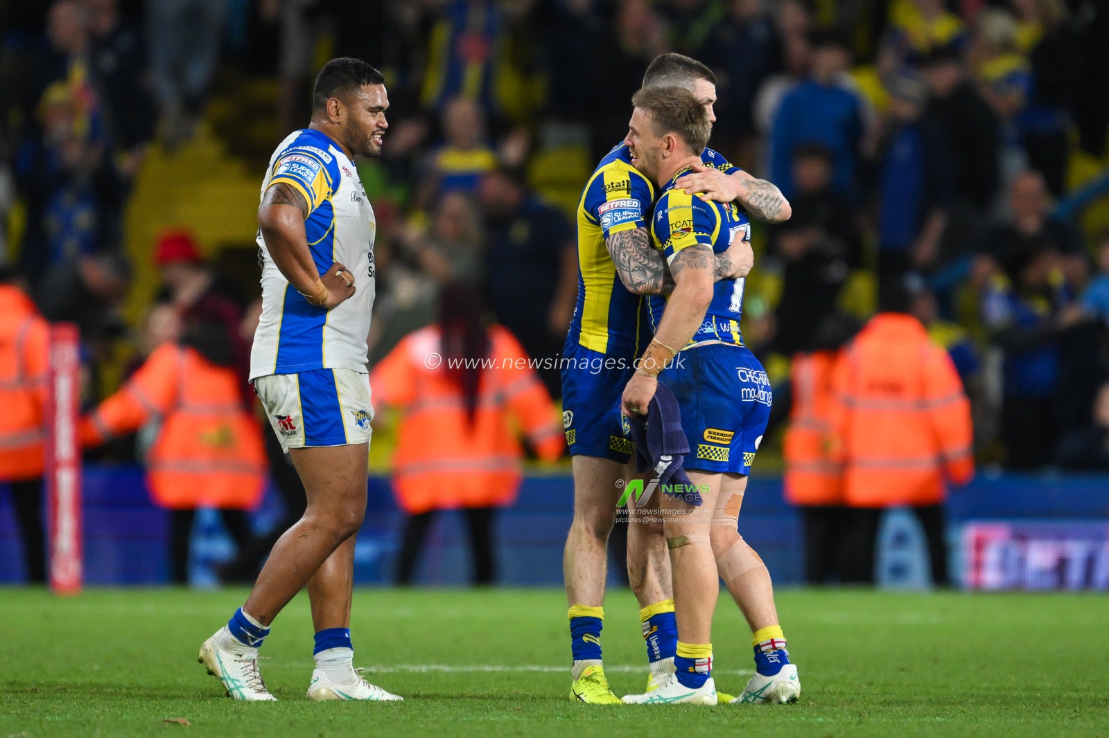 Matt Dufty of Warrington Wolves and John Bateman of Warrington Wolves embrace and celebrate the victory at the end of the  Magic Weekend match Warrington Wolves vs Leeds Rhinos at Elland Road, Leeds, United Kingdom, 17th August 2024

(Photo by Craig Thomas/News Images)