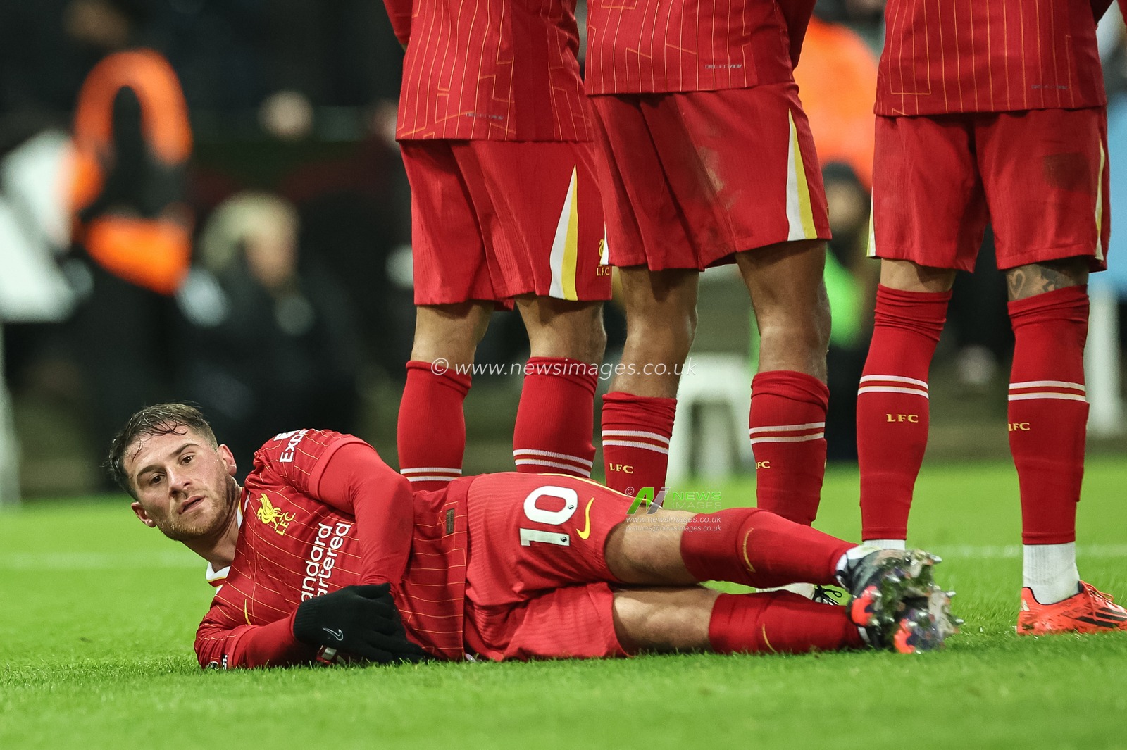 Alexis Mac Allister of Liverpool lays on the floor for a free-kick during the Premier League match Newcastle United vs Liverpool at St. James' Park, Newcastle, United Kingdom, 4th December 2024

(Photo by Mark Cosgrove/News Images)